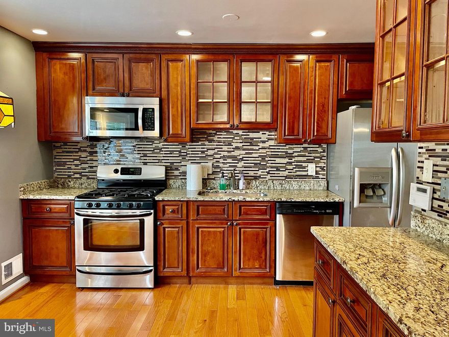 This beautiful home is situated on a large corner lot.  The home features 4 bedrooms and 3 full baths, 2 car garage with a concrete stamped driveway.  The gourmet kitchen has custom cabinets and granite counter tops with a bay window.  Hardwood on the entire first floor, staircase, hallway and main bedroom.   Main bathroom was remodeled  2020 which includes heated floors and double headed shower.  The family room has a large fireplace surrounded by stone with a quartz base.  Lower level bathroom was updated in 2019.  The two tier deck is great for large gatherings, rear fencing , and a large sunroom with 8 sliding glass doors that let a nice breeze flow through, it also has two skylights. Seller offering flooring credit for dated carpet in bedrooms.