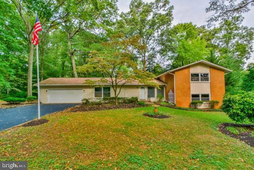 Completely remodeled split level home in sought after Gingerville Manor Estates. Geothermal heating and cooling unit that will keep your utility bills low.  Hardwood flooring on three levels. All bathrooms and kitchen have been remodeled in the last few years.  Brand new roof with architectural shingles. Too many new things to list.  Community offers great amenities including:  pool, lake, basketball court, ball field, and a pavilion.  HOA is very interactive. Offering food trucks, holiday house decorating and dress up contests, American flags throughout the community for 4th of July, clean ups, and many other things.  Tenant is still in the home so please be understanding in scheduling showings.  We need to schedule around their schedule.  Thank you in advance!