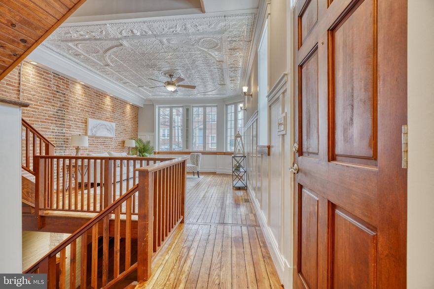 AMAZING! Wonderful New Renaissance renovation with 4 bedroom 3.5 bath rowhome in Federal Hill. This 16-ft wide end of group dream home features a 2-car garage, 4 finished levels, 800 square foot rooftop deck, finished lower level, granite counter tops, stainless appliances, newly refinished wood floors, new paint, wainscoting, crown molding, tin ceiling, exposed brick, custom built cabinets and bathroom vanities, reclaimed wood window sills, new carpet in master bedroom, wet bar, built-in bookshelves, lots of natural lights, open floorplan,  LARGE BEDROOMS, SO MUCH SPACE, the list goes on!