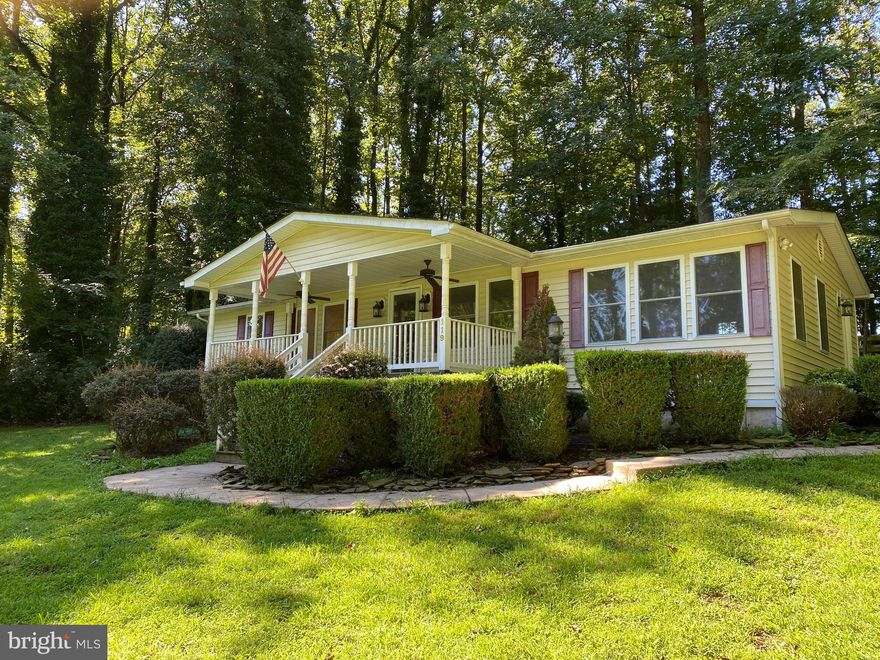 2020: New roof, new floors, new appliances, fresh paint, new 45' deck, new vinyl porch railings, updated bathrooms, new light fixtures and ceiling fans. Shed sold As IS.