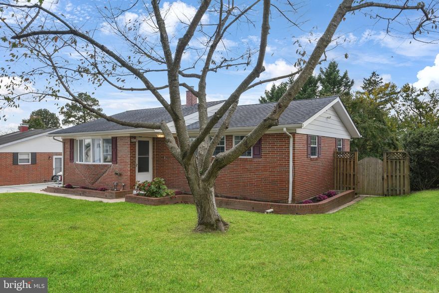 Beautiful All-Brick Rancher in Perry Hall estates!  This gorgeous 3BR/2BA home has been lovingly updated and features (original) hardwood flooring in the Living Room, Dining Room, and all 3 main level Bedrooms.  LVP flooring was installed in kitchen while renovating to include updated cabinets and pulls, beautiful quartz countertops, stainless steel appliances including a refrigerator (with water and ice in the door), a smooth cooktop (cerran) 5-burner electric stove, a dishwasher and built-in microwave.  The lower level is fully finished with LVP floor throughout the spacious Family Room.  There is also a 2nd kitchen (located in the lower level) that includes cabinets, counter-tops, a 4-burner electric stove, (no refrigerator, but there is space for one).  The lower level also has a full bathroom (with low-step) extra-wide shower, too.  This level has previously been used as an in-law suite using temporary room dividers for the sleeping area.  There is a full-size washer and a front load dryer (located within the 2nd kitchen area).  The lower level has a rear exit/entry door that connects (via a few steps) to the huge (15' x 30') flagstone covered patio.  There is also a side entry door that leads to the kitchen for easy grocery unloading, and the side entry also connects (via stairs) to the lower level.  There is "built-in" shed on the back of the home, and a detached garden shed (located to the rear of the yard), a spacious and level privacy fenced rear yard, dual entry gates (on either side of the home), a raised planting bed, an off-street 2-car driveway, and many more features that you'll surely enjoy.  See it today!