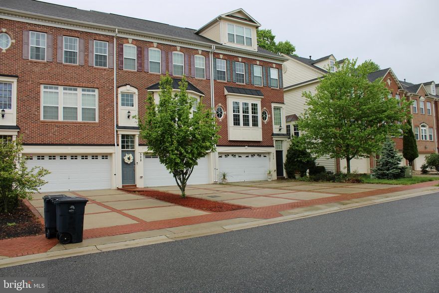 CLASSIC end unit, four level, brick townhome located in secure access community on golf course. This  cozy, light filled home features an open floor plan, hardwoods throughout the main level, a fabulous view of the golf course from south facing, sun-filled, rear windows, half baths on the main and lower levels, gas fireplace at lower level and walk out back yard. The large, open kitchen has ample space for dining, stained oak cabinetry, a large center island with tv console, stainless steel appliances, gas stove,  access for optional deck off of kitchen,  and three large front windows that illuminate the main level. Upper Level 1 has three bedrooms,  two full bathrooms, full sized washer and dryer and large landing that could be a room, library, kids play area, loft, work space, you decide! Upper Level 2 has master suite with fourth bedroom, Romanesque tile at jetted, sunken tub, standing stall shower, double vanity, two large closets, one walk-in, and provides your private oasis within this four level home. Two car garage and parking pad allow parking for your family and guests. The community, Oak Creek Country Club and golf course, features multiple tennis courts,  an 18 hole, 7111-yard, par 72 championship course with putting greens and practice range, miles of trails, restaurant on site,  conference room, community room,  exquisite landscaping, & 24-hour security at front gates.