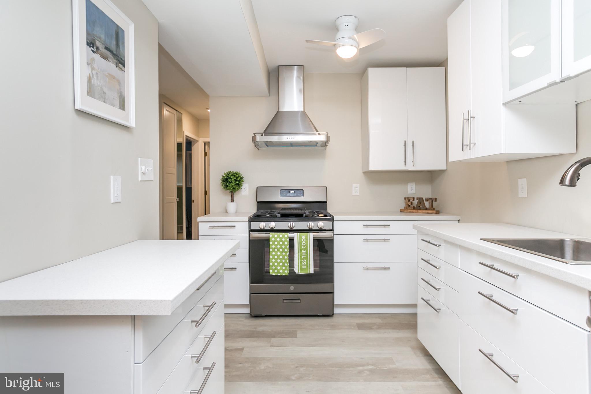 Functionality and beauty were put into every detail of this updated and convenient 2 bedroom/1 bathroom condo in Towson. Walls were removed to expand the kitchen, more lighting added, and closet organization was optimized. The kitchen is a dream with modern white cabinets and fingerprint resistant slate appliances! Contemporary vinyl plank flooring and fresh paint throughout. Newer HVAC, updated electrical and plumbing. Full size washer and dryer in unit. Large, secure storage 3' x 8'. Walking distance to the mall, dining, entertainment, etc. but on a quiet residential street. This condo is impeccable and will not last long! Schedule to see it today!