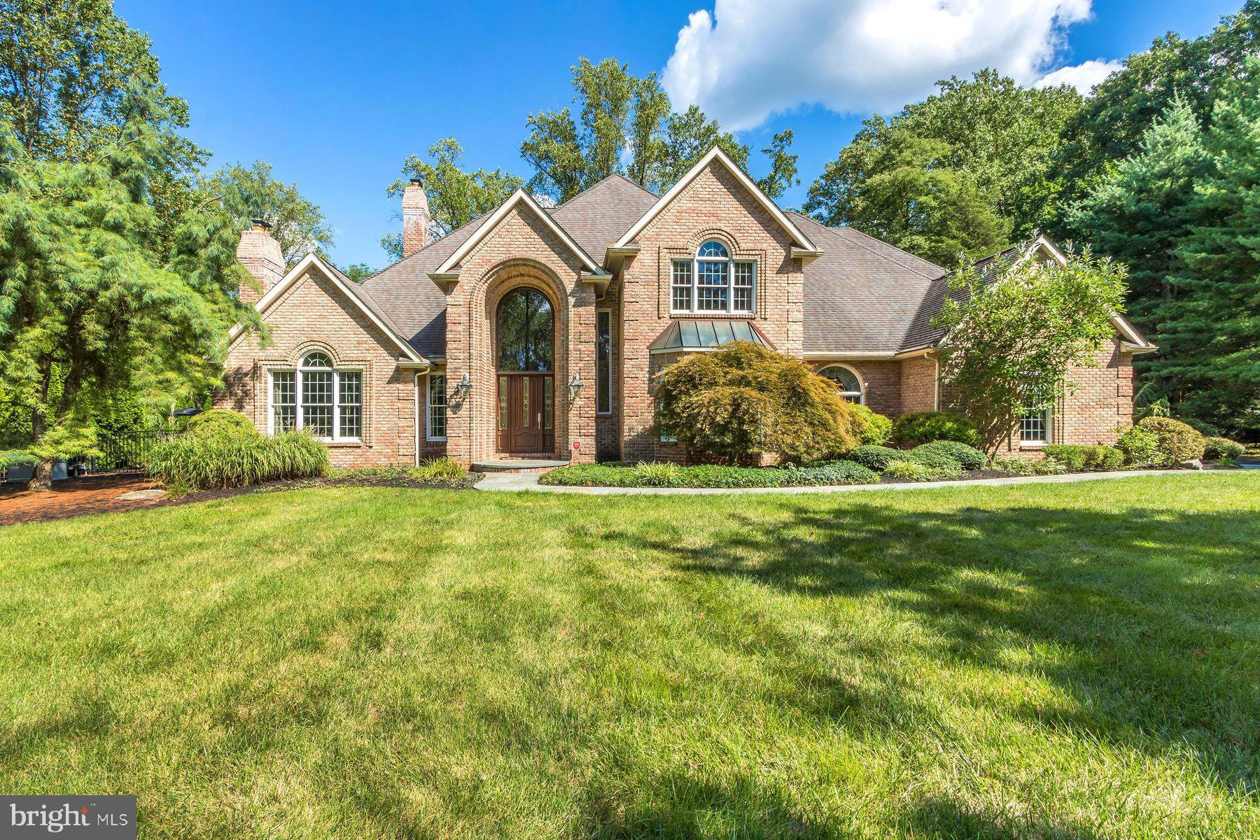 Welcome to 3500 Windy Bush Rd, an enchanting property nestled in the picturesque landscape of New Hope, PA. This stunning custom-built home offers a perfect blend of modern comforts and timeless charm. It is situated on just under 2 acres with a private gated entrance that provides both privacy and tranquility. Upon entering the home you will be greeted by a spacious marble, 2 story foyer with palladium windows and a sweeping staircase to the second floor. The large gourmet kitchen boasts high end appliances, ample counter space, beautiful cabinetry and a huge center island/breakfast bar. There is a lovely 2 story open concept living area filled with natural light and a gorgeous floor to ceiling stone fireplace. A pub/tavern room with high vaulted ceilings offers a full wet bar with stool seating for 8 and a fireplace with cozy couch seating. This room is sure to be a favorite for entertaining as well as family gatherings. There are doors leading out to the covered terraces for additional seasonal enjoyment. The first floor also has a beautiful formal dining room as well as a wood paneled office with custom built-ins. Also on the main floor is a large guest suite with full bath as well as a large laundry room and an additional powder room. The second floor has the owner’s suite which is a true retreat offering a sitting area, large luxurious en-suite bathroom complete with jetted soaking tub as well as 2 large walk-in closets. There are an additional two well-sized bedrooms and 2 full baths. The fully finished basement is a wonderful space with recessed lighting and tile flooring. There is so much room that you could make each area your own. There is a game room area, an area for an in-home gym, another space for a home theatre as well as lots of storage area and additional closet space. There is a half bath as well as a full bedroom suite with full bath and a mini kitchenette which would be perfect for an au pair or in-law suite. Outdoor amenities include a beautiful fenced and landscaped yard with a wraparound blue stone terrace, parts of which are covered for inclement weather. There is a free form pool with spa and a rock waterfall as well as expansive lounging areas around the pool for sunning and cocktails. A pool house includes a changing room with a bathroom and shower. The mature landscaping makes this a very private and beautiful area for both family and entertaining friends. The home is just minutes from New Hope and Lambertville with charming shops, fine dining and scenic parks making this an ideal spot for those who appreciate both nature and culture. Perfectly located 70 minutes to NYC, 50 minutes to Philadelphia and just 30 minutes to Princeton.