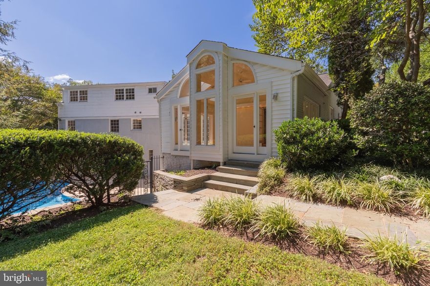 Exceptional mid-century modern home in Bethesda’s highly sought-after Fort Sumner
neighborhood! <br>
This stunning custom-built 7/8-bedroom, 4-bath residence featuring a
private pool, 3-car garage, and prime location just one mile from Washington, D.C.
perfectly blends timeless mid-century architecture with modern updates and expansive
living spaces filled with natural light.<br>
The main level boasts a spacious primary suite, two versatile bedrooms/offices, two new
bathrooms, a large living room, elegant formal dining room, architect-designed
sunroom, and a bright kitchen with adjoining breakfast room and a cozy family room. Off
the kitchen and dining room, step out to a stunning flagstone patio, perfect for outdoor
entertaining or relaxing private gatherings.<br>
Upstairs, discover four generous bedrooms, a beautifully renovated full bathroom, and a
large walk-in attic offering ample storage. The lower level is an entertainer’s dream with
a large recreation room featuring a fireplace, wet bar, and a gym, a bedroom/den,
full bath, laundry room with laundry chute, and direct access to the pool and garage.
This versatile layout offers a great opportunity for multi-generational living or formal and
informal entertaining.<br>
The oversized 3-car garage, a major upgrade in this neighborhood, offers unmatched
scale, storage, and space for vehicles or hobbies.<br>
With refinished hardwood floors throughout, three fully updated bathrooms, fresh paint
in every room and recessed lighting, this home offers exceptional quality and style. Just
steps from parks, tennis courts, and playgrounds, a short walk to the Capital Crescent
Trail and minutes to Georgetown, downtown Bethesda, key commuter routes, and
Reagan National and Dulles airports, this beautiful home combines style, space, and an ideal location.
Don’t miss this rare opportunity to own a true Fort Sumner gem!