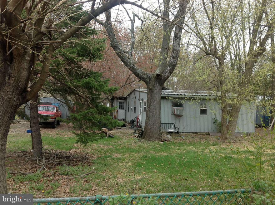 Reduced 15k SOLD AS-IS. Value is in the land. Estate sale. All utilities working and have been winterized. Half acre lot in prime location. Private dirt road entry with a flat lot that backs to woods. Bring your imagination or build your dream home.