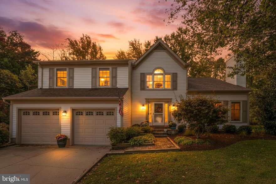 Outstanding value, this beautifully updated home feels brand new with high-end finishes and thoughtful upgrades throughout! The open Colonial floor plan features an updated kitchen that seamlessly flows into the inviting family room, perfect for both everyday living and entertaining. The luxurious primary suite offers two walk-in closets, a comfortable sitting area, a soaking tub and separate shower. The fully finished walkout basement, featuring ceramic tile flooring a bedroom and a full bath, provides even more versatile living space. Step outside to a private backyard with plenty of room for entertaining, play, or relaxation, offering the perfect outdoor retreat. Located in a vibrant community with resort-style amenities—including an Olympic-size pool, tennis courts, and walking paths leading directly into Quiet Waters Park—this home combines modern elegance, comfort, and convenience. Move right in and enjoy the exceptional value and lifestyle this property offers!