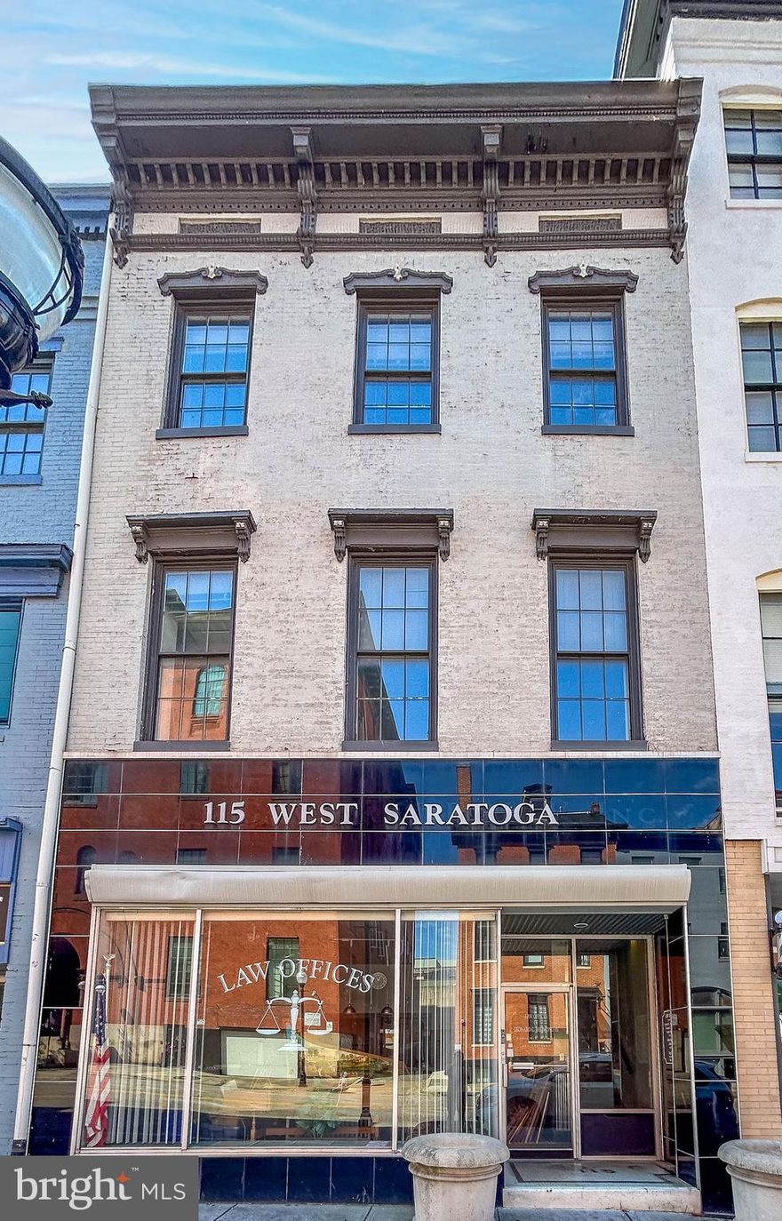 List Price is opening bid. Online Auction Only! Bidding begins Thursday May 7, 2026 & ends Tuesday, May 12, 2026 at 1:00 PM. 115 W Saratoga St – Prime Downtown Baltimore Opportunity

Positioned in the heart of downtown Baltimore’s vibrant business district, 115 W Saratoga Street presents a compelling opportunity for investors, owner-users, or boutique office operators seeking a well-located commercial asset.

This approximately 5,190± SF building offers flexible space with classic Baltimore charm. Formerly utilized as a law office, ideal for professional services, creative firms, retail, or mixed-use potential. The property’s
C-5HT zoning supports a wide range of commercial uses, allowing for adaptability in a rapidly evolving downtown market. The First floor is improved by a reception area, conference room, offices, restrooms, & a patio area- a perfect place to enjoy seasonal blooms, greenery, & fresh air.
The second floor includes a reception area, conference room, offices, and restrooms. The gutted third level presents a blank canvas for your vision, complete with a rooftop patio. The lower level offers additional unfinished space with ample storage. 

Located less than a block from Charles Center and only blocks to Lexington Market, transit hubs, and the inner harbor, the property benefits from exceptional accessibility via Metro Subway, Light Rail, and major bus lines. Surrounded by key landmarks including CFG Bank Arena, the Hippodrome Theatre, and the University of Maryland Baltimore campus, the area draws consistent traffic from professionals, students, and visitors alike.

With nearby parking garages and a highly desirable location, 115 W Saratoga Street combines convenience with urban energy. This is a rare chance to secure a foothold in one of Baltimore’s most connected corridors. Make the needed updates and renovations for a strong upside potential through repositioning or long-term hold.
