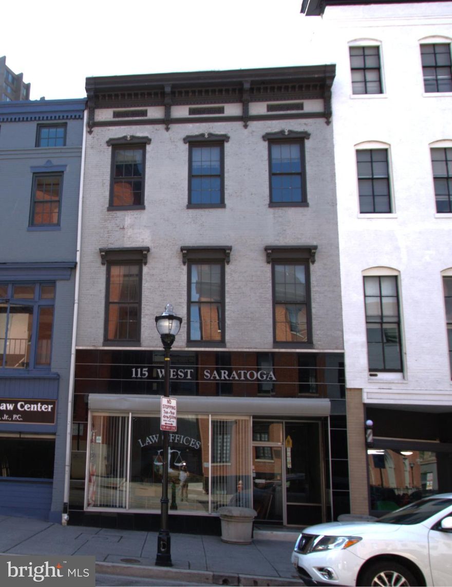 List Price is opening bid. Online Auction Only! Bidding begins Thursday May 7, 2026 & ends Tuesday, May 12, 2026 at 1:00 PM. 115 W Saratoga St – Prime Downtown Baltimore Opportunity

Positioned in the heart of downtown Baltimore’s vibrant business district, 115 W Saratoga Street presents a compelling opportunity for investors, owner-users, or boutique office operators seeking a well-located commercial asset.

This approximately 5,190± SF building offers flexible space with classic Baltimore charm. Formerly utilized as a law office, ideal for professional services, creative firms, retail, or mixed-use potential. The property’s
C-5HT zoning supports a wide range of commercial uses, allowing for adaptability in a rapidly evolving downtown market. The First floor is improved by a reception area, conference room, offices, restrooms, & a patio area- a perfect place to enjoy seasonal blooms, greenery, & fresh air.
The second floor includes a reception area, conference room, offices, and restrooms. The gutted third level presents a blank canvas for your vision, complete with a rooftop patio. The lower level offers additional unfinished space with ample storage. 

Located less than a block from Charles Center and only blocks to Lexington Market, transit hubs, and the inner harbor, the property benefits from exceptional accessibility via Metro Subway, Light Rail, and major bus lines. Surrounded by key landmarks including CFG Bank Arena, the Hippodrome Theatre, and the University of Maryland Baltimore campus, the area draws consistent traffic from professionals, students, and visitors alike.

With nearby parking garages and a highly desirable location, 115 W Saratoga Street combines convenience with urban energy. This is a rare chance to secure a foothold in one of Baltimore’s most connected corridors. Make the needed updates and renovations for a strong upside potential through repositioning or long-term hold.