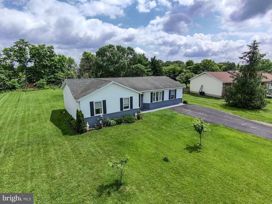 Welcome home to this fantastic 4-bedroom, 2-full bathroom property, offering an expansive lot in a coveted, established community. This residence invites relaxation with its year-round sunroom, conveniently located off the back. The living room impresses with a vaulted ceiling, while a separate dining room provides a classic touch. A standout feature is the generously sized fourth bedroom, offering superb flexibility. Combine these interior comforts with a truly impressive outdoor space, and you have the perfect setting for making lasting memories.