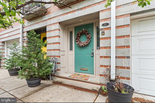 A spacious townhouse on a quiet and charming block offering GARAGE parking, and a blend of modern elegance and comfortable living in a sought-after neighborhood. This impressive residence features three bedrooms, a versatile den, and two and a half bathrooms with a huge pantry, a large laundry room, and an oversized garage. You'll find the home to be deeper from front to back than most others, so it feels less vertical than the competition. Upon entering, you are greeted by a convenient garage with direct access to the lower level, which includes a flexible bonus room ideal for a family room, playroom, home office, or fitness area. Sliding patio doors lead to a private, fenced backyard, perfect for outdoor enjoyment. The main living level showcases an open and airy layout, highlighted by a spacious kitchen equipped with stainless steel appliances, quartz countertops, a large pantry, and a breakfast bar. The kitchen seamlessly flows into the expansive living and dining area, boasting abundant natural light, soaring ceilings, and elegant wide-plank hardwood flooring throughout the living and dining areas, as well as all bedrooms. The second floor hosts two well-proportioned bedrooms, a full bathroom, and a conveniently located laundry room with linen storage. You can feel the elbow room on each floor. The upper level is dedicated to the master suite, featuring a generously sized bedroom, a spa-like bathroom with an oversized shower and a standalone soaking tub, ample closet space, including his, hers, a linen closet, and a private balcony. This exceptional townhouse offers the convenience of garage parking and is ideally situated on the cusp of Pennsport and Queen Village. It provides easy access to the city and major thoroughfares, such as I-95. This is a remarkable opportunity to acquire a stunning and spacious home in a prime location.