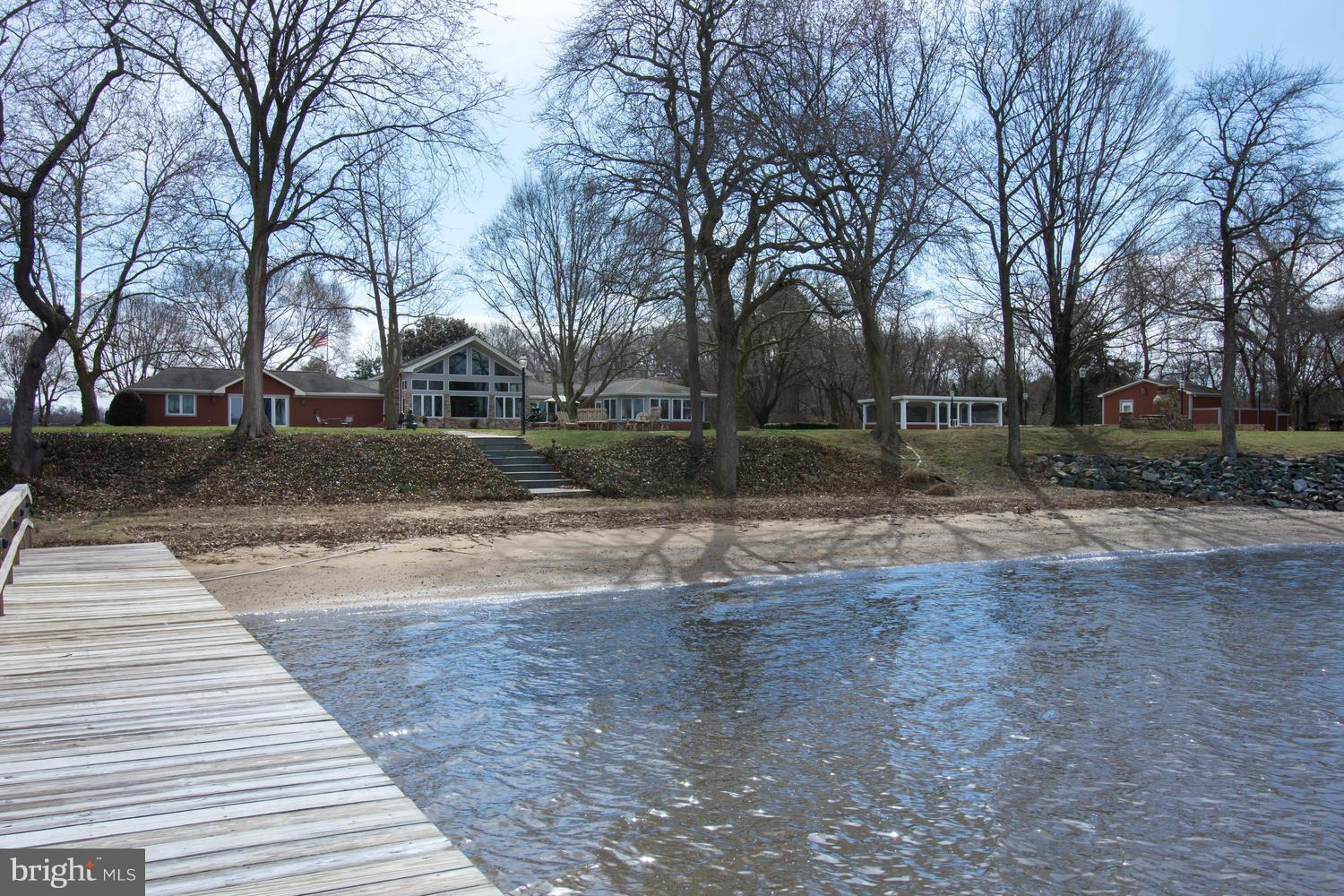 Magnificent waterfront home offers incredible sunsets & broad views of the Chester River w/ floor to ceiling windows. Beautiful architectural entryway, gourmet kitchen & large master suite w/ walk-in closet. Waterside pool w/ screened porch, pool/guest house, stone pathways & patios. Private setting on 3 acres w/ 300 of shoreline, sandy beach & private dock. Minutes from Downtown Chestertown!