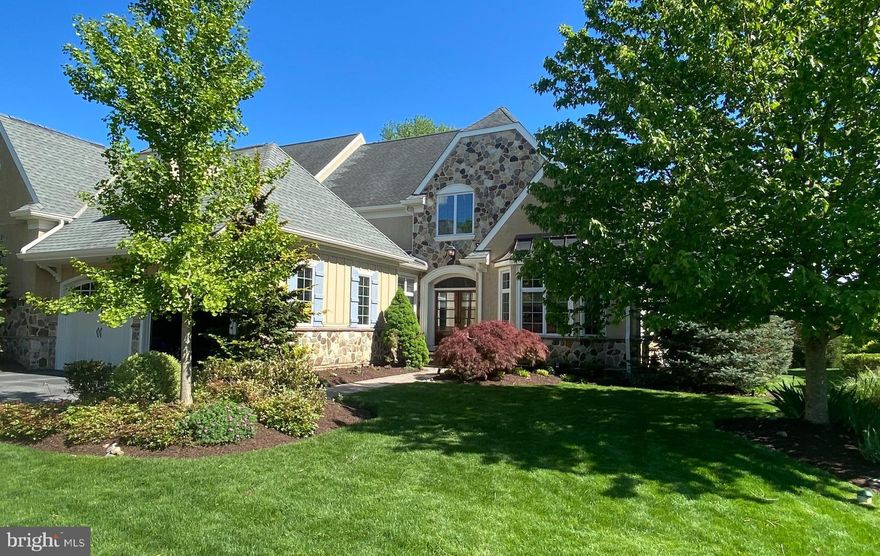 The minute that you enter this stylish, sophisticated home, you know that the Sellers have loved the home and taken great pride of ownership.   These meticulous owners thoughtfully planned out every space and arrived at a perfect blend of family functionality and entertainers wow factor!  This exceptional “Treymore Great Room” model carriage home sparkles with style  and elegant touches throughout the 3850+ Square feet of custom living space.
When you enter the gracious foyer, you immediately notice the beautiful arched entries, stunning wide-plank, site finished oak flooring, gorgeous millwork, elegant, curved staircase off to the right and sight lines into the main living spaces.
With the vaulted and beamed ceiling, the large The Great Room is a knockout!  The owners had built-in custom cabinetry created for entertainment equipment and wine storage.  This is just steps away from Palladium double French doors that lead out to a showstopping hardscape patio with plunge pool and waterfall. (One of a very few in the neighborhood!)  Perfect flow for entertaining!
The chef’s Kitchen has  42” white custom cabinetry, marble island and countertops, a double oven, warming drawer and a five burner high-performance cooktop.  There is plenty of counter seating space, plus a cheerful breakfast area.  The Dining Room directly off from the Kitchen has elegant moldings and a circular tray ceiling that lends itself to gracious gatherings.
The first floor with 9-foot ceilings throughout, also has a private home office overlooking the front of the house; a charming powder room and a spacious laundry room leading out to the two car Garage. And this main floor ALSO has the star of the show…  the large, bright Main Bedroom Suite with a romantic gas fireplace, and an ensuite bathroom with custom frameless shower, soaking tub, heated floors, and expansive adjacent walk-in closet.  
Walk up the elegant staircase and you will once again be wowed.  There is a second en-suite bedroom with walk-in closet and another fireplace and French doors leading into a private sitting room. (No wonder the builder referred to this as the “Princess Suite!”).  Also, on the second floor is a second guest bedroom with ensuite bath, a bonus room for added flexibility and a loft space for lounging or to be used as a second office space.
The Lower Level has an additional 1,500 of square footage.  It is currently unfinished and used as an art studio and storage.  It is a table rosa waiting for you to bring it to life to meet your desires!
The exterior remediation on this home is 100% completed and comes with a warranty.
The Haverford Reserve community includes 120 acres of preserved parkland, over five miles of walking trails; a dog park, sports fields, a recreation center and playground.  The community is conveniently located minutes from the Septa Train; convenient to Center City Philadelphia; Philadelphia International Airport and all commuting routes.  Great shopping and dining are moments away in Ardmore, Haverford and Bryn Mawr and the community is very convenient to Villanova, Haverford and Bryn Mawr colleges.