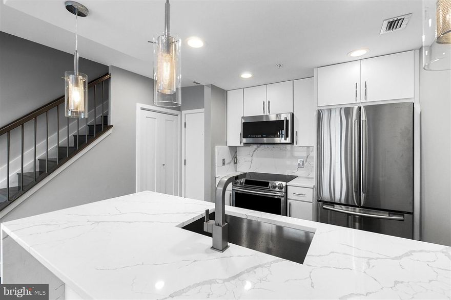 Stunning 1 Bedroom, 1 Bathroom Condo In Historic Fells Point - Residence at Henderson's Wharf! This Two-Level Unit Offers Hardwood Floors, Tons Of Natural Light, Family Room With Private Balcony Access, Kitchen With A Very Large Island,  Stainless Steel Appliances, & More! The Master Bedroom On The Upper Level Includes Master Bathroom With Laundry For Convenience! This Building Is Just Blocks Away From Shops & Restaurants, Boardwalk Access From Fells Point To Canton And Much More!!