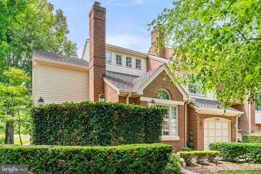 Follow the brick walkway to a private courtyard and enter this charming 3817 sqft, 4 level townhome. The entry foyer leads to a LR with vaulted ceiling, fireplace and French doors that open to the courtyard. Large DR with bay window. Custom kitchen with inset door cabinetry, island, quartz countertops, glass tile backsplash, large farmers sink, Bosch/ LG appliances and kitchen island. Family Room with skylights, custom built-ins, brick fireplace and French doors to a large deck overlooking a landscaped yard. Up a level is the primary bedroom suite with vaulted ceiling, walk-in closet, sitting room and luxury bath + a second bedroom/office with a private bath. On the top level is a lovely bedroom with an ensuite bath. Walkout lower level has a large recreation room, brick fireplace, bedroom area and full bath, perfect for an in-law or guest suite. Two laundry areas with W/D in the primary suite and another W/D on lower walkout level. 4 bedrooms, 4 1/2 baths, central vac, 3 fireplaces, remodeled bathrooms. Private, fenced rear yard with paver patio and custom landscaping. Wood "plantation style" shutters plus architectural detail and custom batten-board millwork throughout. Located in Aspen Grove, a unique community of 25 homes on 7 acres of beautiful common grounds shared by historic Aspen Manor. Just one mile from Fairfax City and nearby shopping, dining and entertainment including numerous festivals and parades. Minutes to George Mason University. Less than 5 miles to Vienna Metro and close to the VRE. This house is a "Must See".