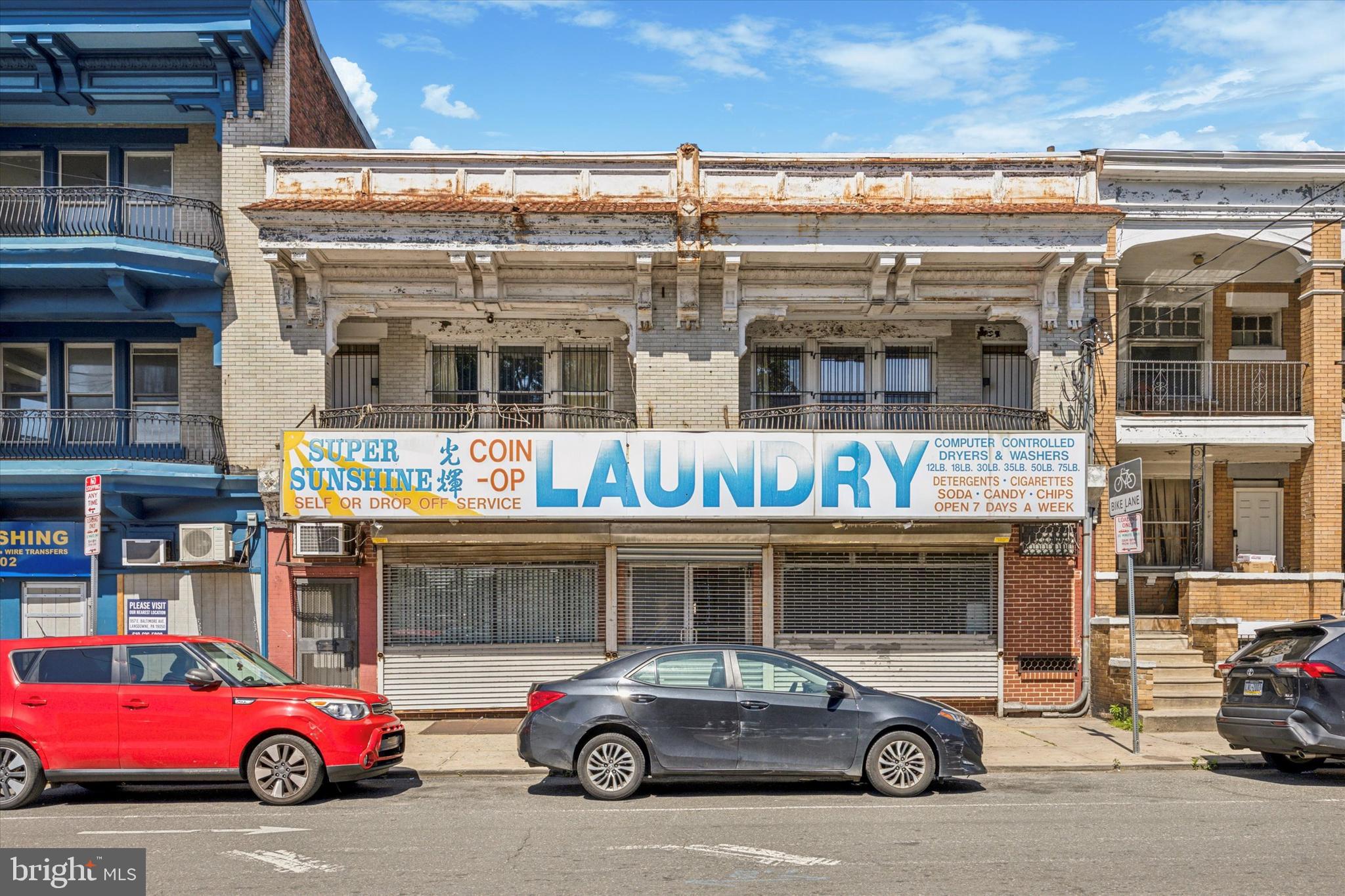 Unique Mixed-Use Duplex with Commercial Laundromat in Prime Location! Fantastic opportunity to live and work in the same building or generate income by renting one or both units. This property features a fully functional laundromat on the 1st floor and a spacious 4 bed/3 bath apartment on the second floor. 2nd floor: The residential unit was renovated 5 years ago with new electrical (dedicated panel in unit) and central air conditioning, which also services the laundromat office. It features an open and airy layout, complemented by light wood flooring and a bright, welcoming atmosphere. The chef's kitchen features a vented range and chef-grade appliances, all of which are included in the sale. The primary bedroom boasts an open-concept layout, a private en-suite bath, and a custom walk-in closet. The 2 front bedrooms each have private balconies and share a full bathroom. Another bedroom and a full bathroom complete this 2,187 sf apartment. 1st floor: The laundromat has approx. 35 washers & 38 dryers (half of which are non-functional) and a half bath. Equipment sold as-is — great value-add potential for upgrades or conversion to another commercial use. Additional profit centers include selling snacks & drinks, and a leased ATM that generates $0.75 per transaction. The 1st floor features access to a large patio, ideal for guests or potential business expansion. The large basement has floor drains and ample storage, accessible via a hatch in the laundromat office. Utilities: Three electric meters: one for the apartment, one for the first floor, and a separate meter for laundry operations (the latter two are billed together). The 1st floor pays for hot and cold water for the entire building. The heat is separately metered. Location Highlights: situated just off a busy intersection (58th & Baltimore Ave) — excellent foot traffic and visibility. Steps from the trolley line, providing easy access to University City & Center City. Short distance to Cobbs Creek Park, Malcolm X Park, and other green spaces. Near major institutions, including the University of Pennsylvania, Drexel University, and CHOP. Come set up shop at 58th & Baltimore and make your mark in this vibrant and evolving neighborhood.