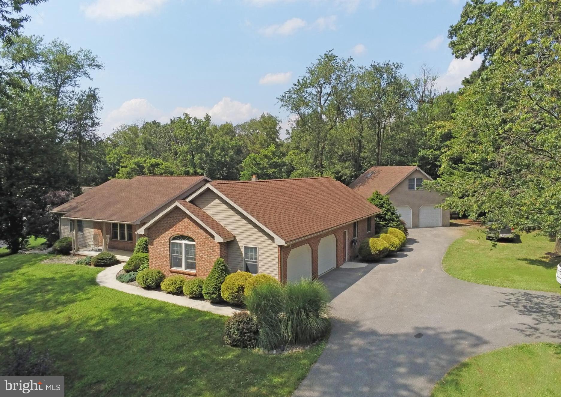"ENJOY QUIET LUXURIOUS OUTDOORS"...Spacious rancher with split plan situated on nearly 2 acres! Room to make the cookies in this beautiful kitchen/breakfast nook combo with granite countertops. Equipped with Stainless steel appliances. Formal dining. Vault & wood floors in family rm plus large rear rec room! Enjoy evenings on brick patio with smokeless wood burning firepit. 3 bedrooms (with possibility of 4th), 2 1/2 baths in main house plus garage/apt with 1 bedroom, full bath & kitchenette, all set up for teenager space! (Included in square footage-current tenant $600 a month)...additional income! Includes 4 car garage and multiple workshop space! Brand New central air , Andersen Windows! Smart door locks, smart thermostats. Doggy door all set up+ fenced rear yard! Beautifully located between mountain & fields! South of Carlisle, only 10 minutes to I-81 access! What a Great Country Lifestyle! Many possibilities!