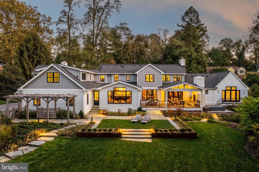 It is a pleasure to present this truly exceptional and beautiful home to the market. Built just four years ago as a forever home for the current owners, this stunning property is now available only due to a job opportunity the current owners couldn’t turn down. No expense was spared, and no detail overlooked in creating this custom 5-bedroom, 5.1-bath home, complete with a pool and pool house. 
Located in the desirable Shand Tract neighborhood and constructed with the highest quality materials and craftsmanship, this home features an open floor plan with all the amenities today’s buyers are looking for. The modern design boasts great curb appeal with its white exterior, black windows, and a cozy fire pit nestled into the bluestone front patio. 
The gorgeous 1.1-acre private fenced rear yard feels like an escape to a vacation retreat, featuring a stunning pool, pool house, pergola, and a covered deck with a wood-burning fireplace, built-in grill, and refrigerator drawers.  Mature landscaping surrounds the yard for privacy, with ecologically friendly native plantings for easy maintenance. 
Inside, the custom open floor plan is designed for both everyday living and entertaining. The gourmet kitchen features top-of-the-line appliances, quartz waterfall countertops, custom cabinets, and a walk-in pantry with a built-in bottle filler. The kitchen flows seamlessly into the breakfast area and family room, which boasts abundant windows offering spectacular views of the property. The formal living room, currently used as an entertaining lounge, is equipped with built-in seating, a wet bar with a dual-zoned wine refrigerator. The first floor also includes a mudroom with a charming Dutch door, a bonus game room/homework room providing extra space for various activities.
The spacious first-floor primary suite, off a private hallway, is a luxurious retreat. The spa-like bathroom features heated tile floors, a heated towel rack, and dual vanities with built-in electrical outlets inside the drawers. The closet includes a stacked washer and dryer for added convenience. From the primary suite, you have direct access to a small deck that leads to a secluded hot tub—an ideal escape from the busyness of everyday life.

This house was designed with flexibility in mind, allowing you to use many rooms for different purposes. The fifth bedroom, complete with a full bath, is located on the main floor and is currently a home office. Upstairs, you'll find a spacious secondary primary suite with stunning views of the rear yard, an en-suite bathroom, and his-and-her closets. The second floor also includes 2 bedrooms with organized closet systems that share a hall bath. Additionally, there is a second family room, a home office and a convenient laundry room.
The finished lower level offers a large seating area, a gym with a daylight window, a full bath, and an unfinished area for storage.
Outside, near the pool, you'll find a custom pool house equipped with a full bath, a washer and dryer, HVAC, a full kitchenette, water bottle filler, indoor/outdoor bar, Murphy bed, and a sleep loft. The house also has an attached 3-Car Garage equipped with high-end storage solution on the walls.
Located in the Tredyffrin-Easttown School District, one of the top school districts in the country, this exceptional home is near downtown Wayne, Devon Yard, Whole Foods, Trader Joe's, and numerous private schools. Convenient access to the train Line and major highways add to the appeal. Don’t miss this rare opportunity to own a home of the highest craftsmanship in one of the most desirable neighborhoods on the Main Line.