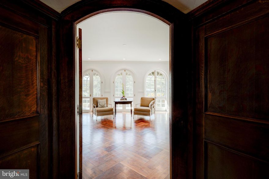 Situated on a quiet block in Chestnut Hill, 7716 Navajo has everything today's buyer wants: spacious and bright first floor living spaces; a large, topline kitchen with the form and function that the "heart of the home" deserves; luxurious marble-clad bathrooms, and copious closets and storage.  Fully renovated in 2020, move right into this beautiful Arts & Crafts gem that is so conducive to 21st Century living.  With its open spaces, big windows, numerous exterior doors, and natural finishes; this  four bedroom, six bathroom home  is a  beautiful example of the architecture  that called for a relationship with the outdoor world,  a use of natural materials, and fine craftsmanship.  From the covered front steps, enter a paneled vestibule with charming powder room to the right.  From the vestibule, enter a light-filled reception hall for greeting guests  and accessing the back patio.  To the left of the front hall is the beautiful living room with its  wood burning fireplace, expansive windows and doors, custom millwork, and coffered ceiling.  Through the living room, at the east end of the house is a bright sunroom with windows on three sides and a door that leads to a private covered patio.  Back to the front hall, to the right, is the formal dining room and the substantial kitchen.  Substantial, not only in size, but with the finest appliances and finishes, such as Subzero, Wolf, and quartz.  The kitchen is a cook's dream with long expanses of counter and plenty of storage.  The first floor is completed with a large laundry room, coat closet, and entrance to the lower level.  Ascend the main staircase to the family quarters.  One wing of the floor is dedicated to the primary suite with its bedroom with cathedral ceilings, a sumptuous primary bathroom with double sinks, a free-standing soaking tub, and huge walk-in shower.  The dressing room is outfitted with custom built-ins.  To the left of the staircase are two more large bedrooms,  each with its own bath and large closets. The third floor offers another bedroom and another full bath,  plenty of storage,  and a charming balcony overlooking the backyard.   There is a finished space in the lower level, perfect for watching TV, exercising, or crafting.   There is also a half bath on the lower level.  The two-car garage can be accessed from the lower level of the house and has an extra storage room at one side.  
 The home  sits on a knoll, up off the road, with a beautiful beech as a focal point in the front yard, and nearly three quarters of an acre of land.    Chestnut Hill's commercial district,  verdant parks, commuter rail line, and numerous cultural institutions are simply a walk away.  The home is fully updated with new mechanicals, updated electricity, renovated kitchen and baths. and all run on an "enterprise" wireless internet network (which will need configuration and software licenses), with failover power, and 2 internet providers; a state-of-the-art security and alarm service that includes detection for flood, heat, and fire. The house is solar panel and battery design ready. Grand, but not overwhelming, this one has stood the test of time very well indeed.  Several years left on the tax abatement.