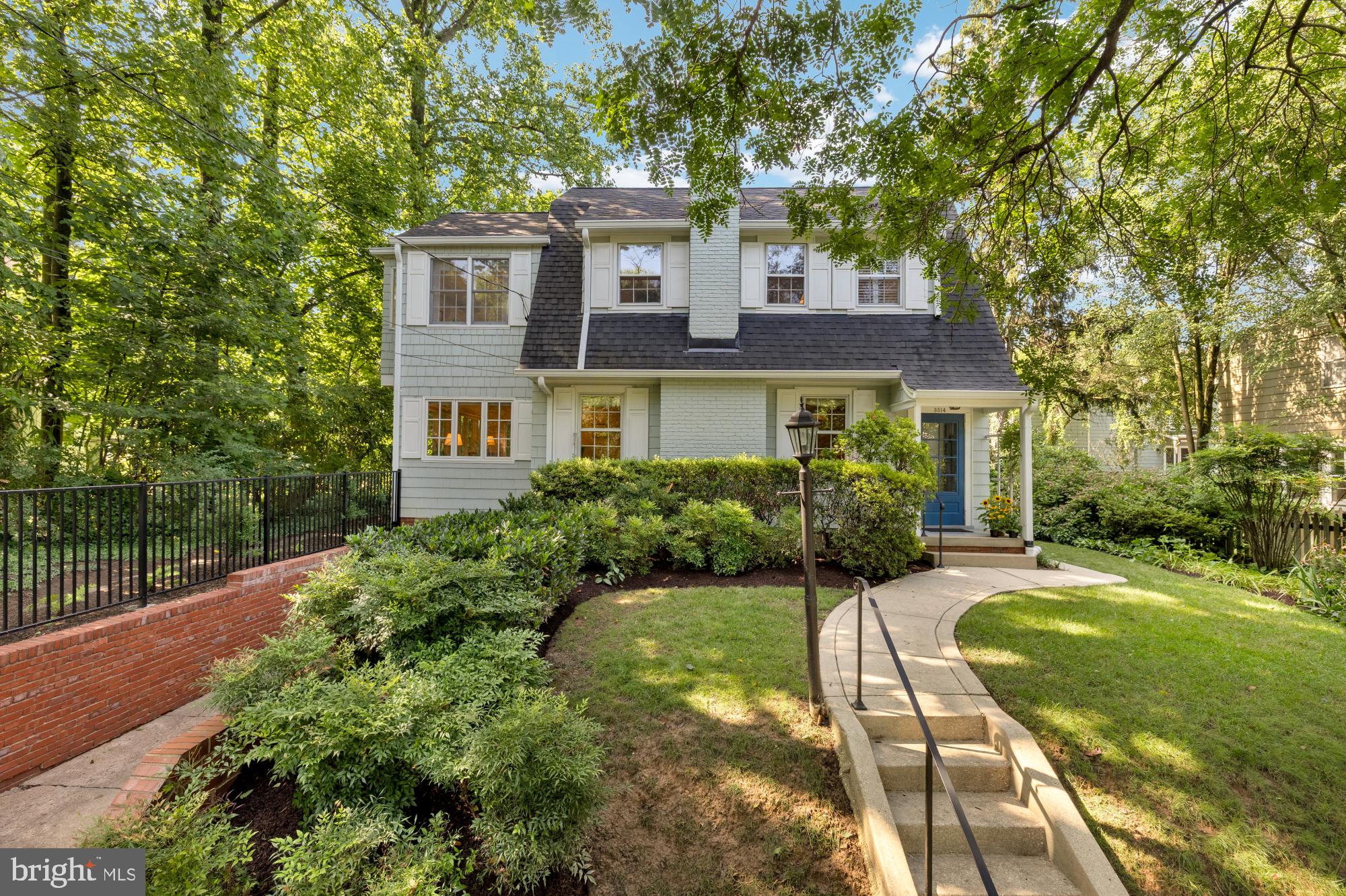 NEW LISTING! Open Saturday and Sunday 2-4 PM. Welcome to this quintessential Dutch colonial nestled in the sought-after Martin's Addition neighborhood of Chevy Chase. Timeless curb appeal, a spacious floor plan, and updates throughout, this 4 bedroom 3 bath home offers the perfect blend of character, comfort, and convenience. Step inside to find warm hardwood floors, generous natural light, and thoughtfully designed living spaces. The formal living room features a cozy wood-burning fireplace, while the separate dining room is perfect for hosting family gatherings and dinner parties. The dining room opens to the patio, creating seamless indoor-outdoor living. The spacious family room is drenched in sunlight from 3 directions, and can also be used as home office or guest room with attached full bath. The bright, updated kitchen includes abundant cabinetry and a breakfast bar that opens to a sunny and cheerful breakfast room. An enormous skylight illuminaes the space, which overlooks the private backyard—ideal for morning coffee or casual meals. Upstairs, you'll find four spacious bedrooms, including a serene primary suite with vaulted ceilings, en-suite bath and plenty of closet space. Outside, enjoy a professionally landscaped yard, mature trees, and a quiet street perfect for evening walks. Don’t miss this extraordinary opportunity to live in this special neighborhood. Steps to the organic farmer’s market, the Shops at Brookville, the popular restaurant La Ferme, Shepherd Park and playground and the highly-regarded CCUMC Preschool, which serves as a feeder to the award-winning Chevy Chase public school cluster. Walkability, quiet setting, and eligibility for membership in the popular Chevy Chase Recreation Association Swim and Tennis Club (CCRA), make this home a smart choice for today’s homebuyer. Whether you're looking for a place to grow, entertain, or simply relax, this home checks all the boxes.