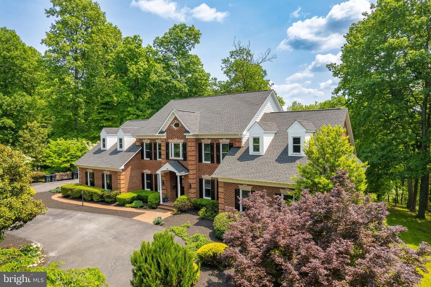 ***Reduced Price, GREAT value***Welcome to Fox Haven Lane, a 13-acre private paradise neatly tucked in a  beautiful forest at the end of a nearly half-mile private driveway. Almost every inch of the 7500+ ft of luxurious living space was recently remodeled. The owners spared no expense to bring new life into the six bedrooms and six and a half bathrooms. Cook a meal in the newly remodeled gourmet kitchen with Viking appliances, use the Comcast high speed internet for a virtual meeting in the massive home office, or cast a line into the pond; Fox Haven offers something for the entire family. Ornate stone pillars greet you as you approach the home on a beautiful circular driveway leading to its majestic brick front. Enter the home through a brand new front door into a vaulted entry hall with exits to the office on the right, the formal dining room on the left, stairs to the second floor. Continue straight past the stairway to a newly renovated powder room and into the main living area, a large, open, light-filled, fully wainscoted family room with a wood-burning fireplace bracketed by two brand new triple-wide glass doors to the back patio that overlooks the pond, Stream music from the recently installed in-ceiling surround sound.  The living area is open to a fabulous gourmet kitchen with quartz countertops and soft-close cabinets. The kitchen is a chef’s delight, with a six-burner Thermador range with a built-in griddle. A double farm sink is augmented by an additional farm sink built into a giant island for preparing large meals or intimate visits with friends and family. The kitchen includes Viking appliances including a huge double-door refrigerator / freezer combo as well as double-door Viking Oven. Behind the kitchen is a very large breakfast room with light streaming in from a northeast-facing window, all of which were replaced in 2023. Or, host formal dinners from a large butler’s pantry with wine refrigerator in a beautifully appointed dining room with wainscoting and high ceilings.  When ready to work, travel a few steps to the southwest side of the house into a very large office with light streaming in from a large window revealing beautiful built-ins surrounding a gas fireplace. The first floor owner’s retreat, just off the office on the back of the house, has its own built-ins around another gas fireplace and a lovely exercise or sitting room overlooking the backyard, pond and south end of this beautiful property. The owner’s bath is newly renovated with shower, double sinks and a huge tub underneath large windows. Additionally, doing laundry will be as convenient as possible, as the massive laundry room sits directly across from the owners retreat. Upstairs are four additional bedrooms, each with its own en-suite, newly renovated bathroom. Also upstairs is a large, cedar-lined closet for long-term storage. For additional living space, step down to the huge, mostly-finished basement. To the right find a large wine cellar and an expansive storage room that houses the brand new water treatment system, Generac backup generator connections, over $15,000 worth of audio visual equipment, and rows of shelving, all of which convey. As you exit the storage room, you will make the trek across the large family space / recreation room with another gas fireplace. You’ll pass a large newly updated full bathroom on the right. As you approach the brand new walk-out basement door, you will see the area for a second home office, or take a right and head into the sixth bedroom. A large gym room rounds out the basement area, all leading back to the HVAC room connected to the recently replaced AC units outside. This gorgeous property is move-in ready, offering luxury living in a quiet, secluded sanctuary with gig-speed WiFi, a true rarity in rural Loudoun County. Just minutes from Purcellville or Middleburg, Virginia and only 35 minutes from the Dulles corridor. Come take a look today!