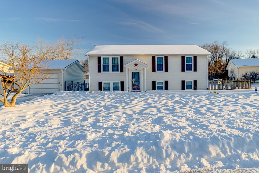 Welcome to this 3 bed, 3 full bath, single family home just outside of downtown Havre De Grace that is priced to sell!  This split foyer home has a detached garage, fully fenced rear yard, wood deck, and roof that is only 5 years old.  Pull into the driveway and enter in through the front door, a short flight of stairs takes you to the main level with lvp flooring throughout.  To the left is a living room area which circles around into the formal dining area and then into the kitchen.  Sliders off of the dining room area open out onto the rear deck which overlooks the backyard that is surrounded with high privacy fencing.  Back inside, the kitchen has plenty of cabinetry, all stainless steel appliances, laminate counters and a tiled backsplash.  Also on this floor is a hallway that leads to a full bath with a tub/shower combo, as well as three bedrooms.  One of these bedrooms is the owners suite with its own private full bath with a walk-in shower.
Taking a short flight of stairs from the front door takes you to the large finished basement with a carpeted recreation room, a separate carpeted family room, and a room that could serve as a fourth bedroom or be made into an office or hobby room.  There is also a third full bath down here with a walk in shower, as well as a laundry room with plenty of room for storage and access to mechanicals.  A walk out from the basement leads you out into the private rear yard.  This house has everything for a family and is move in ready and waiting for you!