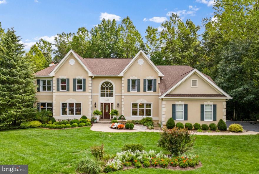 Spectacular home on quiet cul-de-sac, backing to trees, in the coveted community of Annapolis Preserve Set back from the street on almost an acre of beautifully landscaped land, this impressive home combines comfortable living with elevated touches throughout the home. The oversized driveway with basketball hoop, 3 car garage and plenty of room for parking, sets the stage as the perfect family home with plenty of room to entertain.  The welcoming stone pathway to the front door is accented by the soothing sounds of the water fountain. Step inside to appreciate the elegant 2 story foyer, grand staircase and the formal living and dining room. The formal spaces effortlessly flow into the open concept kitchen, casual dining and family room at the rear of the home. The family room with stone fireplace and spacious gourmet kitchen with center island, gorgeous backsplash and breakfast nook, combine for the ideal space for everyday living and gatherings of all sizes. Family and guests will appreciate the expansive back deck with adjoining screened porch. This spectacular porch features vaulted wood ceiling, composite deck flooring and LED lighting. The perfect location to relax or entertain throughout the year. The adjacent laundry room/mudroom with dog washing station and wine refrigerator to service the screened porch, adds to the home's practicality and smart design.  Ascend to the upper level, where you'll discover a serene and spacious primary bedroom with sitting room and spacious ensuite bath, a true retreat at the end of the day. An additional ensuite bedroom provides privacy for guests, while two more large bedrooms share a well-appointed bath, ensuring comfort for everyone. The unfinished lower level provides over 2,000 additional sqft. of space to complete in any way you wish! The wide lot backing to woods on a peaceful cul-de-sac ensures privacy, making it a secure haven for relaxation. Welcome Home!