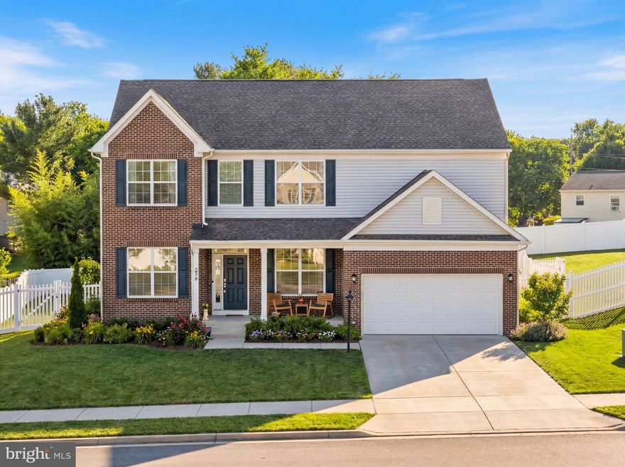 Situated on the sought-after east side of Winchester, 236 Lehigh Drive is an immaculately-maintained former model home that perfectly captures a sleek, like-new aesthetic. Spanning an impressive 4,600+ square feet, the residence is defined by a spacious, open, and airy floor plan where natural light pours through expansive windows to highlight high-end finishes and updated designer fixtures throughout. A charming covered front porch leads you into a main level built for seamless flow, anchored by a gourmet chef’s kitchen featuring upgraded countertops, a center island, stainless appliances and a sleek backsplash. This culinary heart opens directly to a bright breakfast room and additional sitting area with vaulted ceilings, as well as a sun-drenched living room with a floor-to-ceiling stone fireplace. The main level also provides ultimate convenience with a half bath and a dedicated laundry room. Every space feels intentional, from the formal dining room with its stylish accent wall to the private home office set behind elegant glass French doors. The upper level is remarkably expansive, featuring a versatile loft and four generous bedrooms: a primary sanctuary with architectural slatted walls and a spa-like ensuite, a second bedroom with its own private attached bath, and two additional bedrooms that share a well-appointed third full bath.  The finished walk-out lower level is a true extension of the home's luxury and is an entertainer’s dream. Meticulously designed with a modern aesthetic, it features a large rec room and family area plus an additional game room space for endless entertainment possibilities. This level also includes a bright, spacious fifth bedroom and a full bath, providing the ultimate setup for guests or multi-generational living. Outdoor living is equally impressive, featuring a relaxing rear deck and a fully fenced-in backyard that is perfect for your four-legged friends to run and play. Set on a nice lot with a classic brick and vinyl exterior and a two-car garage, this home provides a rare combination of polished, high-end elegance and a bright, breezy atmosphere with plenty of space for every lifestyle. Located near commuter routes, schools, shopping and more.