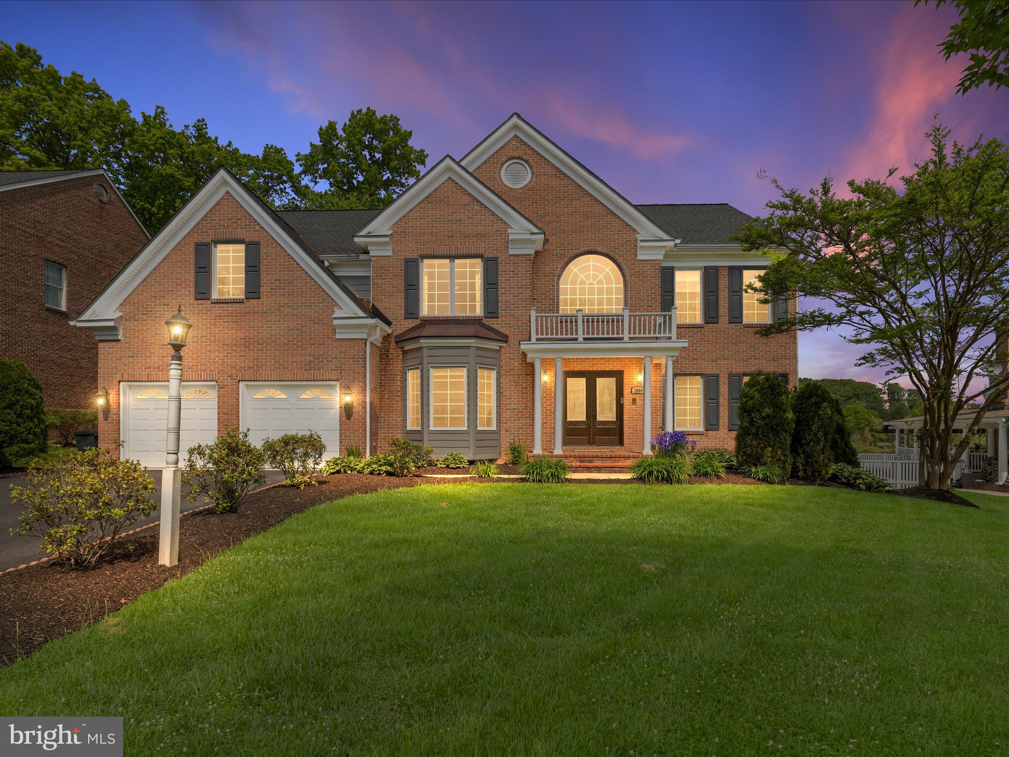 Spectacular brick front colonial located on a premium lot in Turf Valley Overlook with golf course views! This beautifully appointed residence boasts exquisite architectural details, refined design elements and a commitment to quality and style. The chef's kitchen features heated tile flooring, natural quartz countertops, custom Lyptus wood cabinetry with inset doors, upgraded appliances including a 5 burner gas cooktop and a sunny breakfast area. Relax in the impressive two story family room with engineered wood flooring, coffered ceilings and a gas fireplace. Entertain with ease in the spacious living room and formal dining room, both featuring hardwood flooring and custom millwork. The main level office is great for work from home and features custom built-ins. A convenient main level laundry/mud room leads to the two gar garage with epoxy floor and wall mounted storage cabinets. Dual staircases lead to the upper level featuring four bedrooms and three full bathrooms. The primary bedroom suite features engineered wood flooring, cathedral ceilings, two walk-in closets and a spa-like primary bath with Italian marble slab flooring and slab shower walls, dual vanities with rich wood cabinetry with inset doors and granite countertops. Bedroom two features an en-suite bathroom with marble slab flooring, custom shower and granite counters. Bedrooms three and four both feature walk-in closets and share a jack-and-jill bathroom with heated tile flooring and a double sink/vanity with granite countertops. The lower level has all the right spaces including a spacious family room with laminate flooring, a home gym with mirrored wall, a hobby/craft room or second home office and a full bathroom with marble flooring. Private outdoor spaces include a relaxing screened porch and a low maintenance deck overlooking the flat back yard with the perfect combination of trees for privacy and golf course views. The amenities in Turf Valley including recreation, shopping and dining are just steps away. Peace of mind comes with incredible recent mechanical updates including a new water heater in 2023, new Marvin windows, Hardiplank siding and front door in 2020, two Lennox A/C units in 2019 and a 50 year architectural roof in 2016. With refined finishes and thoughtful upgrades, this home is more than just a place to live—it’s a place to love.