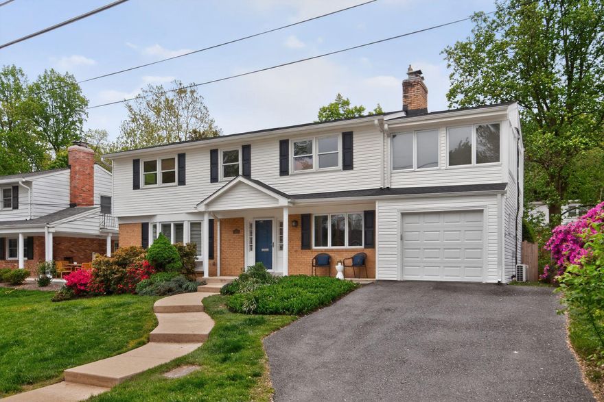 Tucked along a quiet non-through street in the heart of North Chevy Chase and within the highly sought-after BCC High School cluster, this thoughtfully reimagined colonial masterfully blends timeless elegance with the warmth and functionality of modern living. Offering over 3,200 square feet of finished living space, including five spacious bedrooms and four full bathrooms, the home unfolds with gracious, light-filled interiors designed for both sophisticated entertaining and effortless everyday comfort. At the center of the home, the stunning kitchen built in 2019 is a true showpiece, where soaring vaulted ceilings, dramatic architectural windows, and elegant French doors flood the space with natural light and create an airy, sun-drenched gathering place that seamlessly connects indoors and out. Custom cream cabinetry, gleaming granite countertops, stainless steel appliances, and an expansive center island combine classic sophistication with exceptional practicality, while mornings begin with coffee overlooking the lush backyard and evenings flow naturally onto the deck for al fresco dining under the stars.

Formal living and dining rooms accented by plantation shutters offer timeless charm, while the inviting family room—with its cozy wood-burning fireplace, adjoining full bath featuring a luxurious smart toilet, and pocket doors for privacy—adapts beautifully as a guest retreat, main-level suite, or flexible living space. Upstairs, the luxurious primary suite serves as a private sanctuary featuring a spa-inspired bath with its own smart toilet, oversized walk-in closet, and attached private office perfect for working or unwinding in peace. The sun-filled walkout lower level provides exceptional flexibility for recreation, guests, or multigenerational living, offering comfort and versatility for every stage of life.

Outdoors, professionally designed living spaces create a resort-like retreat with a composite deck, covered patio, fire pit, tranquil water feature, and ambient landscape lighting that transforms evenings into something truly magical. Cozy winter nights by the fireplace, summer gatherings under the stars, and peaceful mornings surrounded by beautifully landscaped grounds make every day feel extraordinary. Fully paid-off solar panels and a rare attached garage—an uncommon luxury inside the Beltway—add efficiency, convenience, and long-term value. Ideally located near Chevy Chase Lake, Kensington, Bethesda, and Washington, this exceptional home offers the perfect blend of beauty, comfort, accessibility, and enduring value in one of the area’s most beloved neighborhoods.