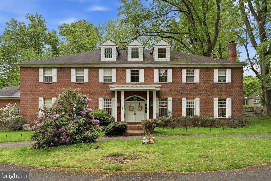 Built like a classic 19th-century estate but fully updated for modern life, this custom brick Colonial sits on 2.35 private acres in Huntingdon Valley. The main floor features 10-foot ceilings, detailed trim work, and a grand two-story foyer with a sweeping staircase. At the heart of the home is a newly renovated chef’s kitchen that opens to a rear patio, a heated in-ground pool, and a built-in spa.The layout offers ultimate flexibility: a main-floor bedroom suite and dedicated office sit privately off the kitchen, while the second floor hosts four massive bedrooms—including a primary retreat with a sitting area, dressing room, and a steam shower. Downstairs, the 3,000 sq. ft. finished basement features a guest room/gym/office space and another full bath. Located in the award-winning Lower Moreland School District, this property offers a rare combination of total privacy and neighborhood convenience.