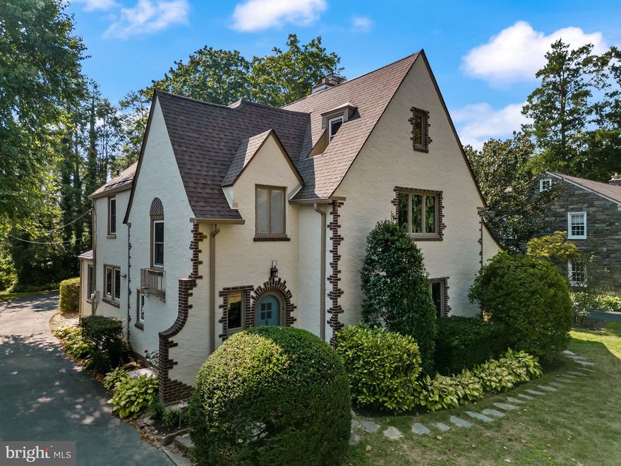 ULTRA-RARE OPPORTUNITY to own a STATELY, RECENTLY RENOVATED, TURN-KEY & MOVE-IN READY 1930's EUROPEAN COLONIAL designed by the renowned architectural firm of WALLACE & WARNER. This sun-drenched residence is perfectly nestled on Medford Road, one of Wynnewood's most desired, QUIET, TREE-LINED STREETS and has been meticulously maintained & thoroughly enjoyed by the same owner for the last 10 + years.  Prominently set back from the street with a long driveway and a private 2 car garage this elegant residence sits on a beautifully landscaped .26 + acre lot w/ serene views of nature, yet it is WALKABLE to the center of Wynnewood (R-5 train to Center City, WHOLE FOODS, STARBUCKS, Shopping & Restaurants) + STEPS to multiple Parks and highly acclaimed Penn Wynne Elementary School (a recipient of the U.S. Department of Education's prestigious Blue Ribbon Award)  part of the nationally recognized LOWER MERION SCHOOL DISTRICT! Built at a time when Artisan Craftsmen took great pride in their work, this residence offers Character & DETAILS of a Bygone Era and OOZES w/ ELEGANCE! Boasting 5 Bedrooms, 3 1/2 Baths and 3444 +/- sq. ft of living space this home offers TASTEFUL & THOUGHTFUL FINISHES & is in ABSOLUTE MOVE-IN CONDITION! The flagstone walk leads to the arched door and entrance foyer w/ Original MERCER TILE Flooring open to the spacious Living Room w/ gleaming, refinished original hardwood floors, crown moulding, gas fireplace and door to covered patio w/ Brick Row Lock accenting dual arches. The Center hall also accesses the HEART of THE HOME - the newly remodeled Chefs Kitchen featuring abundant Furniture Quality Antiqued White Cabinetry w/stunning GRANITE COUNTERS, Large Entertaining Island w/Seating, imported Antiqued Spanish Subway-Tile Backsplash, Stainless Steel Professional GE MONOGRAM Appliances including: (4) burner gas range w/griddle & Professional PROLINE Range Hood, wall microwave & convection ovens, dishwasher, built-in oversized refrigerator, deep Kohler farm sink w/ sprayer and Breakfast Bar w/ Beverage Refrigerator & Bead board Accent accessing the Large Formal Dining Room & Room Sized Butlers Pantry w/ abundant built in storage. Off the kitchen is a door to the driveway as well as inside direct access to the 2 car garage equipped w/220 volt outlet. The serene BACKYARD is Flat, Private & has mature landscaping w/ specimen plantings. Completing the 1st floor is the formal powder room & coat closet and the beautiful turned staircase w/ window & sun-lit landing leading to the EXTREMELY LARGE & PRIVATE OWNER'S SUITE w/ Large Windows on 2 Exposures, 2 WALK-IN OUTFITTED CLOSETS (ONE IS ROOM SIZED) and an updated ensuite bath w/ frameless Shower w/ Tumbled Marble Walls, Toto Washlet toilet, built in medicine cabinets & Quartz topped vanity.  Bedroom #2 offers walk-in closet and EN-SUITE access to Full Renovated Hall Bath with porcelain/carrara wall tile w/ Glass Mosaic accent, Tub/Shower, Modern Vanity and slate porcelain floors - this bath also serves as a hall hath accessing BR #3 which is VERY LARGE w/ 2 Closets. The 3rd floor w/ Original Heart of Pine Floors offers Bedroom #4, Full Hall Bath w/ Clawfoot Tub/Shower and Pedestal Sink & Bedroom #5 with very large walk-in closet. The unfinished WALK-OUT Lower Level is pristine and features a work shop, full laundry, utilities and storage.  This area can easily be finished for additional living space, playroom or gym.  Additional features of this PRISTINE FASTIDIOUSLY KEPT HOME include: New Roof (2017), 15 New Windows (2020), Gut-Renovated High End Kitchen (2016), Remodeled Guest Bathroom (2016), New Rheem Water Heater (2017), New High Efficiency Carrier AC (2019), Converted Fireplace to gas (2014),  200 Amp Electric (2016) and Weil Mclain GOLD boiler (2006). The driveway offers parking for 10 + cars and the rear/side yards offer excellent outdoor/play opportunities.  This PRISTINE-TURN-KEY, MOVE-IN READY HOUSE is a rare gem and  not to be missed!