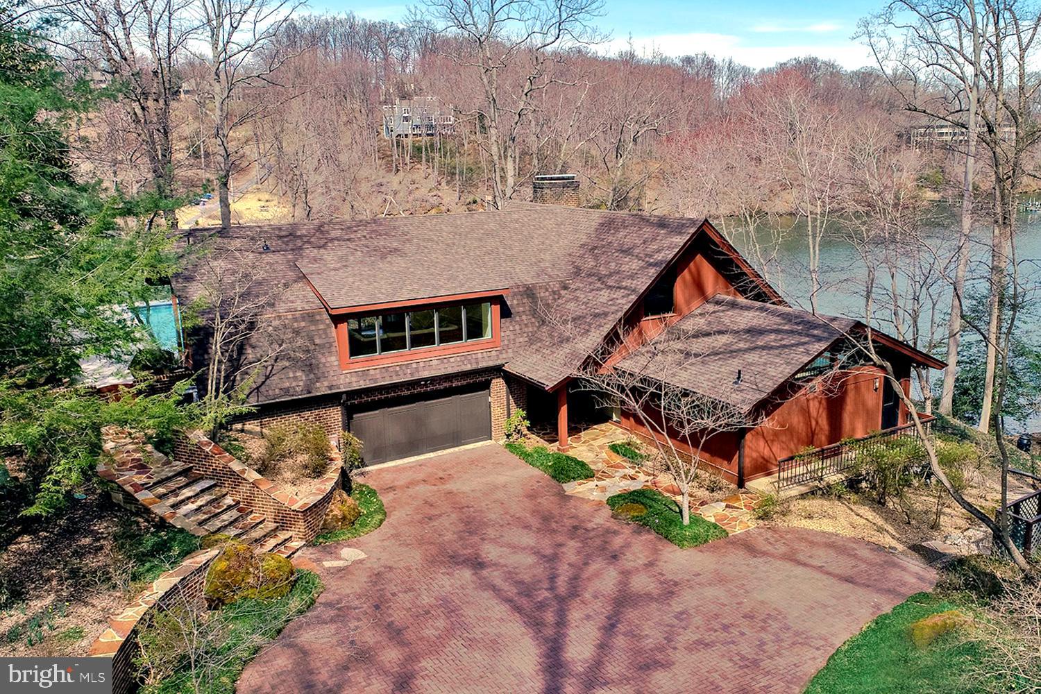Your waterfront oasis awaits you!! Located in a premier location in the highly sought after, amenity rich community of Saefern. The soaring ceilings greet you upon entry, but then your attention is quickly grabbed by the waterviews that will take your breath away from EVERY room in the house! High-end complete kitchen expansion and remodel. Master bath remodel, although you may not be able to take your eyes off of the view from the master long enough to look at it!! Take the stairs or the ELEVATOR to the upper level featuring a wonderful loft office area that leads into the pool room with full bath AND changing rooms. THE POOL! The pool takes on the feel of an infinity pool as it is perched above Clements Creek with views all the way to the Severn River. Downstairs has an expansive entertainment area, three bedrooms,three full baths, and laundry area with secondary kitchen perfect for entertaining. The outside of the home is impeccably cared for with extensive hardscaping and landscaping that all lead to your own personal path to your waterside fire pit. Rip rap work fully and recently complete along entire property!!! New roof, new windows, truly turnkey, nothing left to do except enjoy the summer in this unique and spectacular home!!!