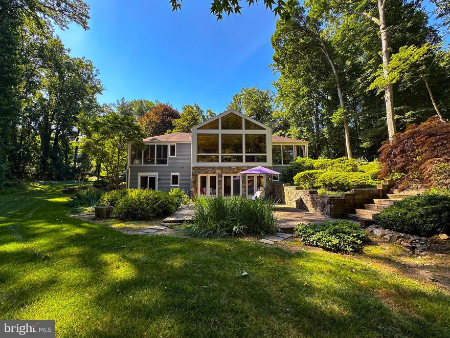 Tucked into a peaceful, wooded setting, this custom-built 5 bedroom home offers a rare blend of privacy, natural beauty, and refined living. Every space is thoughtfully designed to connect you to the outdoors, featuring floor-to-ceiling windows and doors that frame serene forest views and fill the home with natural light.
The dramatic great room and dining area welcome you with soaring ceilings, windows on three sides, rich hardwood floors, and a stunning stone fireplace. Multiple living and family rooms provide flexibility for entertaining, relaxing, or working from home, while four distinct outdoor living spaces invite you to step outside and truly commune with nature.
Set within a luxury neighborhood of distinctive homes, the property is enhanced by mature, meticulously maintained landscaping, stone walkways, and hardscaping that complete this private sanctuary. With thoughtful updates, this expansive 5,200 sq/ft home offers significant equity returns. A very recent sale on Holly Knoll Rd was $1,355,000. This is more than a home—it’s a retreat designed for living beautifully, inside and out.