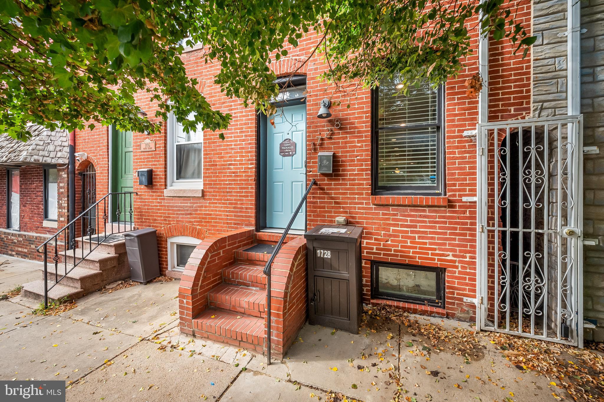 Welcome home to 1728 Gough Street, a conveniently located Fells Point gem! From this tree-lined block, enter the main level, which has an open layout, beautiful espresso hardwood floors, wainscoting, and exposed brick. The kitchen has all of the counter space you could ask for with a large island/breakfast bar and plentiful white cabinetry. Fenced in brick patio out back to unwind or grill. On the second level, the primary suite is in the rear of the home, with a spacious room, walk-in closet and ensuite bath. 2nd bed/bath in front of the home, hall bath was just tastefully renovated. The third level offers an alternative primary suite with vaulted ceilings, large closet, and roomy walk-in shower. There is a wet bar just before you step outside onto your 3rd level TREX deck, another perfect place to unwind or entertain. Laundry on second level. The basement is finished for versatile use. New carpets throughout. Original renovation in 2014. Fantastic rental opportunity with each room with its own bath. Just 5 blocks from the waterfront in Fells Point and a short walk to Patterson Park. Priced to SELL quickly!