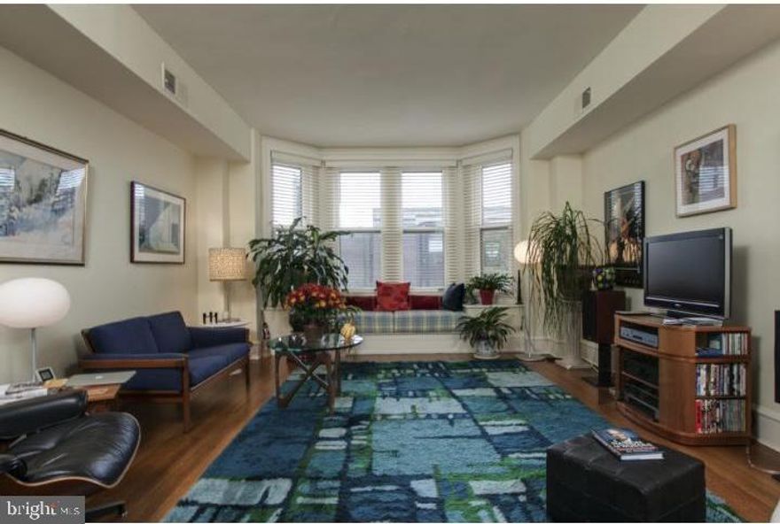 Bright and charming two bedroom, one and a half bathroom flat with high-end features! This home offers crown moldings, high ceilings, and wood floors throughout. The renovated kitchen boasts granite countertops, wood cabinetry, and quality stainless steel appliances. There is a spacious living room with bay windows and a custom window seat. Adjacent to the living room, there is a dining room with custom built-ins. The renovated full hall bathroom has a glass enclosed shower, granite countertop, tile flooring, and decorative half-tiled walls. There is a washer/dryer in the home.