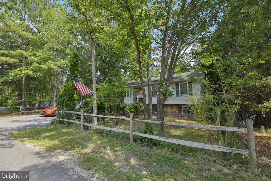 Welcome to this well-maintained 4-bedroom, 3-bath home tucked away on a quiet cul-de-sac in Lusby. The home offers numerous updates for peace of mind, including a newer roof including soffit and gutters (2020), HVAC (2018), outside air controller (2019), neutral carpeting and bamboo wood flooring (2021). The kitchen was fully remodeled in 2021 with all new cabinets, granite countertops & appliances. This unique split foyer offers a primary ensuite along with a hall bath, a unique find in a split foyer!  The basement features a cozy woodstove along with a bedroom and full bath—perfect for guests or multi-generational living. Practical touches include individual shut-off valves for each water line, and the laundry area is equipped with an electric washer (7 years old) and dryer (3 years old), with gas lines available if preferred. Large freshly painted deck off the kitchen allows seamless entertainment. Community is just as inviting, with a few minutes’ away to the community beach, making this home the perfect blend of comfort, updates, and location.