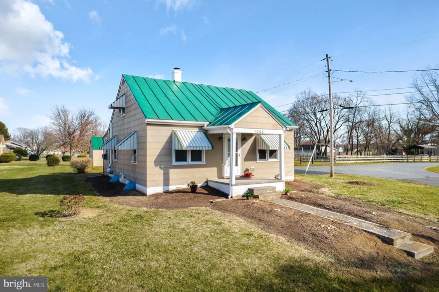 Welcome home! Enter at the portico into your mid-century classic Cape Cod. This home has been lovingly well maintained and updated - just move in and unpack. Beautiful hardwood floors. Traditional floor plan with 2 bedrooms on main level, a 3rd bedroom and an office on upper level and a 4 seasons sunporch off the kitchen.  Enjoy your remodeled kitchen with newer cabinetry, counters, sink & flooring and all appliances included - gas range, refrigerator, dishwasher, built in microwave & disposal. Washer & dryer to convey. Remodeled bathroom with newer vanity & sink, tile board walls and flooring. The new 95% AFUE high efficiency natural gas broiler for radiator heating is so warm. New water heater & expansion tank. Newer Vinyl replacement tilt in windows for energy efficiency. Metal roof recently pro painted and freshly painted interior. Outdoor entertainment spaces on your 17x8’ patio and your level, corner backyard lot. Double paved driveway was just pro sealed. A detached 24x12 foot size garage with electric service &  extra driveway. Additional storage access in attic eaves, drawer built-ins, closet under staircase & mud room and full unfinished basement.  No  HOA.   Location is convenient to I.81 & Rt. 66 commute routes, schools, grocery, adjacent to the community playground, 2 blocks to Historic Town of Stephens City Newtown Commons for local festivals & events, 5 miles to Laurel Ridge Community College and 4 miles to Winchester City.