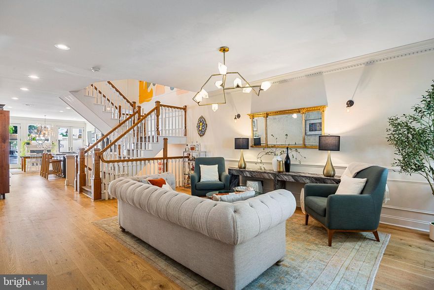 Welcome to 609 S 9th Street — a stunning 3-bedroom, 4-bath residence offering over 3,000 SF of beautifully finished living space, gated 2-car parking with EV charging station (fits two smaller sedans or one large SUV and a compact car or electric scooter), and a coveted address within the Meredith School catchment.

Set on a charming tree-lined street in one of Philadelphia’s most vibrant neighborhoods, this sun-drenched home blends historic character with refined modern finishes, soaring ceilings, and two additional private outdoor spaces.

The open main level is ideal for entertaining, featuring wide-plank white oak floors, a striking central staircase, and a custom mural that doubles as art. The chef’s kitchen impresses with marble countertops, custom wood cabinetry, premium appliances, including a Sub-Zero fridge, wine fridge, Bosch dishwasher, and a large marble island with bar seating. Step outside to the oversized private patio and garden, complete with direct access to parking and an Isaiah Zagar Mosaic on the back facade.

Upstairs, two spacious ensuite bedrooms — one with a private balcony — offer comfort and privacy. The third floor is dedicated to a serene primary suite with another private balcony (with updated Trex decking and new French doors), a custom walk-in closet, and a spa-like bath with dual vanity, soaking tub, and a large walk-in shower with dual shower heads.

The finished basement adds versatility with a full bath, laundry room, plenty of extra storage, and space perfect for a media room, playroom, or guest suite that contains a cozy working fireplace.

Additional highlights include hardwood floors throughout, dual-zone HVAC, and Nest thermostats. Just steps from Whole Foods, Acme, the 9th Street Italian Market, and some of Philly’s best dining spots.

This exceptional home delivers comfort, elegance, and unbeatable city convenience. Schedule your private tour today.