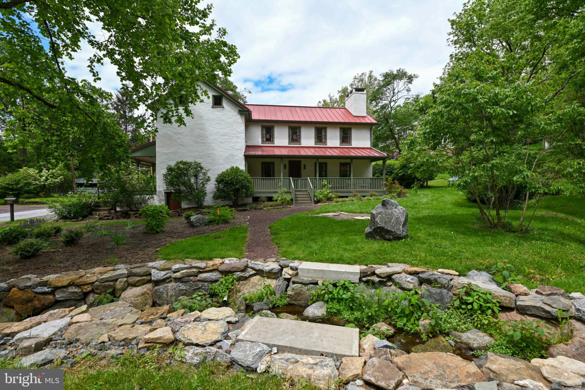 Beautifully maintained and updated historic home in Coventryville Village. Enjoy the historic charm in this along with modern upgrades of central A/C, renovated kitchen and baths, and a spacious main bedroom. Fully furnished in the traditional farmhouse style, this home is move in ready for those new to the area or working on a long term assignment in the Philadelphia region. Located just 20 minutes from the entertainment in Phoenixville, Marsh Creek State park in Chester Springs and the PA Turnpike's Exton access. Located in the historic and quaint village where the Coventryville Forge supplied early America with iron, the home is nestled in a charming setting complete with a spring fed stream. Enjoy this relaxing, park like setting, on one of two covered porches. Includes the use of an outbuilding, on-site laundry and additional off street parking. Can be provided fully furnished (as pictured) for move in ready or vacant. All landscaping and maintenance is provided by the landlord. Perfect for temporary housing or job relocation. Pets on a case by case basis