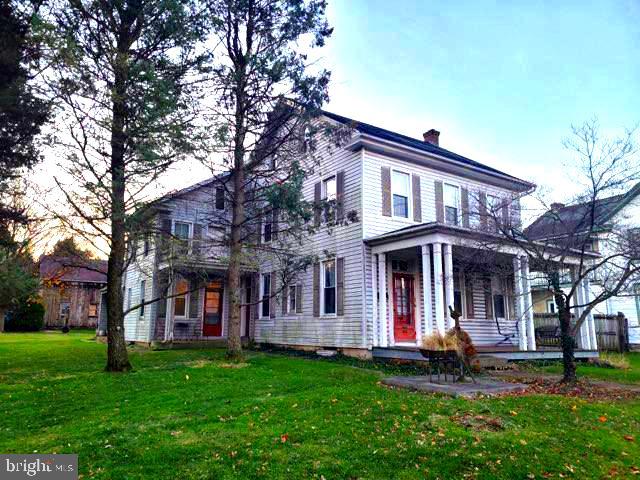 Beautiful farmhouse style home in the heart of Millersville with 10 foot ceilings, large kitchen for entertaining with newer flooring, stunning hardwood floors throughout , curved staircase, old world charm still exists here!! Extra large detached garage/barn complete with 2nd level just waiting for your finishing touches.  Beautifully kept with new interior paint throughout.  Extra large .48 lot that extends beyond the garage/barn for additional private yard space.  Lots of off-street parking on both sides at the end of driveway. 
Relax and enjoy your large living room, family room or the front sitting room as this home is a good 2757 square feet not including the basement space.  Main floor laundry just off the back stairwell.  Dual staircases for easy access to different areas of the home. Be in your new home for the NEW YEAR and enjoy large family gatherings on this unique and very large  property. Home was originally a 2 unit and could  be reconverted for a great investment property! Property is zoned Residential/Commercial.