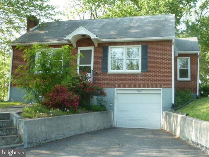 OWNER RELOCATING!  REDUCED FOR QUICK SALES.  Absolutely charming three bedroom brick home located on a spacious  .7350 acre lot on a private low traffic lane just outside the city limits.     Basement with a tiled 1 car garage, rec room with closets, laundry room/full bath.  Make an appointment today and walk into a surprise!