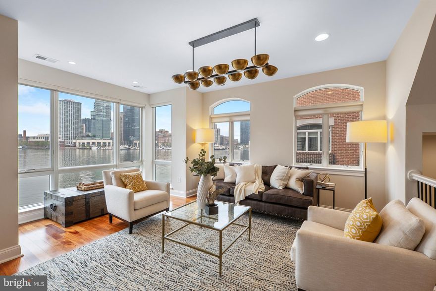 A truly exceptional opportunity to own one of Baltimore’s most unique and coveted residences at the Pier Homes at Harborview. Ponte Villas S offers exceptional proximity to Washington DC and Baltimore’s central business district. Minutes from I95, the nations capital and key DC locations are within 35-40 miles by car and easily accessible via the MARC Camden line in 30-45 minutes. The new corporate campuses of T. Rowe Price and Under Armour are minutes away via water taxi, a short walk or drive. Residents enjoy the best of both worlds — serene waterfront living with effortless access to the nation’s capital. This striking four-level townhome at 650 Ponte Villas South offers an extraordinary living experience with panoramic, stunning views of the Inner Harbor from nearly every room. The seamless connection between elegant interior spaces and the tranquil waterfront setting creates an atmosphere of sophistication, privacy, and serenity rarely found in city living. Enter through a private, secure entrance into the main level, where you will find a private guest suite complete with an en-suite bathroom and convenient elevator access to every floor — ensuring comfort and accessibility throughout the home — and a two-car garage. The next level features an open-concept living space boasting high ceilings, rich hardwood floors, and expansive windows framing the harbor’s waters. The gourmet kitchen features premium stainless-steel appliances, granite countertops, custom cabinetry, and a large breakfast bar — perfect for entertaining. The adjoining dining and living areas — separated only by an elegant double-sided gas fireplace — flow effortlessly toward a private waterfront terrace, ideal for an evening of relaxation while watching boats glide across the harbor. The entire third level hosts a beautifully appointed primary suite offering a sitting area, an additional double-sided gas fireplace, a private terrace, and floor-to-ceiling windows that capture breathtaking sunrise views over the marina. The spa-inspired en-suite bath includes dual vanities, a soaking tub, and a large, separate glass-enclosed shower. A spacious walk-in closet complements the suite’s refined design. The fourth level features an additional flexible social space and outdoor terrace, perfect for entertaining or relaxing, as well as two spacious bedrooms offering generous storage and a well-appointed family bathroom. Take the stairs or private elevator to the spectacular rooftop terrace with wet bar, boasting nearly 1,000 square feet of outdoor living space with jaw-dropping panoramic views — ideal for sunset gatherings or starlit evenings. Residents of the Pier Homes at Harborview enjoy exclusive access to a private, resort-style Health Club featuring a state-of-the-art fitness center, heated indoor pool, whirlpool spa, and sauna — all designed to promote wellness and relaxation. Beautifully maintained waterfront promenades, landscaped courtyards, and a marina setting enhance the community’s tranquil, upscale atmosphere. With 24-hour security and concierge service, residents experience a perfect balance of luxury, comfort, and peace of mind. Living at the Pier Homes at Harborview offers more than a home — it’s a refined lifestyle defined by health, privacy, and spectacular harborfront living. Baltimore’s Inner Harbor is set for an exciting transformation with the $900 million Harborplace redevelopment, breaking ground in fall 2026. The project will replace the aging pavilions with four new mixed-use buildings featuring retail, dining, residential, and vibrant public spaces, creating a revitalized waterfront that enhances walkability, commerce, and livability. This  will further solidify the Inner Harbor as the city’s premier cultural and social hub.