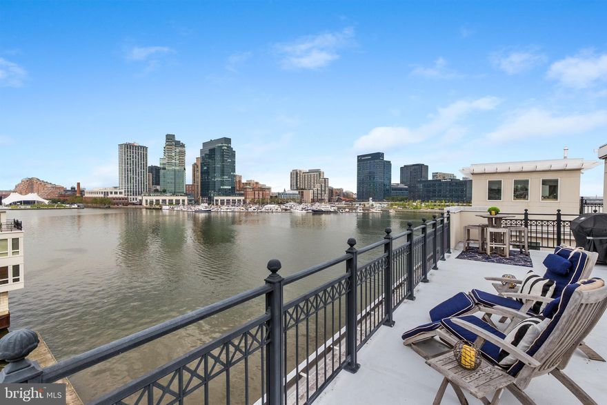 A truly exceptional opportunity to own one of Baltimore’s most unique and coveted residences at the Pier Homes at Harborview. Ponte Villas S offers exceptional proximity to Washington DC and Baltimore’s central business district. Minutes from I95, the nations capital and key DC locations are within 35-40 miles by car and easily accessible via the MARC Camden line in 30-45 minutes. The new corporate campuses of T. Rowe Price and Under Armour are minutes away via water taxi, a short walk or drive. Residents enjoy the best of both worlds — serene waterfront living with effortless access to the nation’s capital. This striking four-level townhome at 650 Ponte Villas South offers an extraordinary living experience with panoramic, stunning views of the Inner Harbor from nearly every room. The seamless connection between elegant interior spaces and the tranquil waterfront setting creates an atmosphere of sophistication, privacy, and serenity rarely found in city living. Enter through a private, secure entrance into the main level, where you will find a private guest suite complete with an en-suite bathroom and convenient elevator access to every floor — ensuring comfort and accessibility throughout the home — and a two-car garage. The next level features an open-concept living space boasting high ceilings, rich hardwood floors, and expansive windows framing the harbor’s waters. The gourmet kitchen features premium stainless-steel appliances, granite countertops, custom cabinetry, and a large breakfast bar — perfect for entertaining. The adjoining dining and living areas — separated only by an elegant double-sided gas fireplace — flow effortlessly toward a private waterfront terrace, ideal for an evening of relaxation while watching boats glide across the harbor. The entire third level hosts a beautifully appointed primary suite offering a sitting area, an additional double-sided gas fireplace, a private terrace, and floor-to-ceiling windows that capture breathtaking sunrise views over the marina. The spa-inspired en-suite bath includes dual vanities, a soaking tub, and a large, separate glass-enclosed shower. A spacious walk-in closet complements the suite’s refined design. The fourth level features an additional flexible social space and outdoor terrace, perfect for entertaining or relaxing, as well as two spacious bedrooms offering generous storage and a well-appointed family bathroom. Take the stairs or private elevator to the spectacular rooftop terrace with wet bar, boasting nearly 1,000 square feet of outdoor living space with jaw-dropping panoramic views — ideal for sunset gatherings or starlit evenings. Residents of the Pier Homes at Harborview enjoy exclusive access to a private, resort-style Health Club featuring a state-of-the-art fitness center, heated indoor pool, whirlpool spa, and sauna — all designed to promote wellness and relaxation. Beautifully maintained waterfront promenades, landscaped courtyards, and a marina setting enhance the community’s tranquil, upscale atmosphere. With 24-hour security and concierge service, residents experience a perfect balance of luxury, comfort, and peace of mind. Living at the Pier Homes at Harborview offers more than a home — it’s a refined lifestyle defined by health, privacy, and spectacular harborfront living. Baltimore’s Inner Harbor is set for an exciting transformation with the $900 million Harborplace redevelopment, breaking ground in fall 2026. The project will replace the aging pavilions with four new mixed-use buildings featuring retail, dining, residential, and vibrant public spaces, creating a revitalized waterfront that enhances walkability, commerce, and livability. This  will further solidify the Inner Harbor as the city’s premier cultural and social hub.