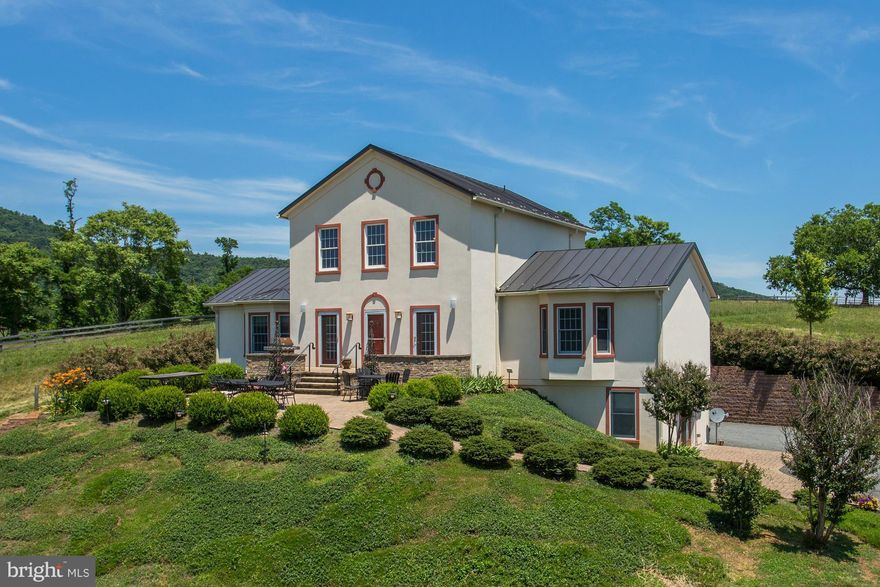 This Provence Style Villa is beautifully crafted and boasts some of the most breathtaking views in the county. Soaring 2 story, 9+ ceilings & light filled rooms abound. Enjoy the exquisite terraces, beautiful landscaping, 2 stocked lakes w private docks and a separate Guest Cottage. Within close proximity to The Inn at Little Washington & Vineyards make this Town & Country living at its finest!