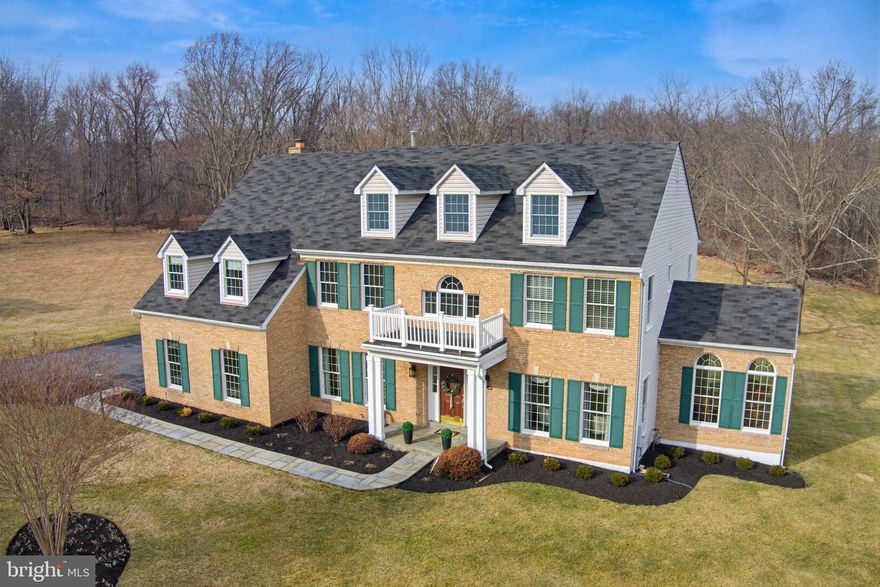 This stunning classic colonial shows like a model home with gorgeous designer touches at every turn.  A flagstone covered entry porch greets you to the two story foyer with palladian window and curved hardwood staircase; built-in shelving in den/home office; gleaming hardwood flooring; cathedral and vaulted ceilings; palladian windows in the music room;  bay windows in the dining room; solarium replete with skylights and windows overlooking lush acreage.   Tasteful crown molding, chair rails, and wainscoting throughout!  Gourmet kitchen with quartz countertops and downdraft gas cooking island with designer pendant lighting; stainless steel appliances to include double wall oven; expansive 42" cabinets;  recessed lighting; tile backsplash; stone woodburning fireplace with raised flagstone hearth in family room.  Laundry/mudroom off garage with sink and walk-in closet.  Tremendous primary suite with vaulted ceilings and adjacent sitting room/home office/nursery.  French doors lead to primary bath with three granite topped vanity sinks; oversized jacuzzi tub; and separate shower with multi-heads and body jets.  Side load garage with epoxy floor.  Two-tier deck with vinyl railing overlooks splendid parkland.  Paver patio with firepit .  Lower level boasts a very sophisticated and upscale living space to include a recreation room with walkout, wet bar and a full bathroom.   Large storage area.  Outdoor storage space/shed under sun room.  Experience this magnificent home to believe it!  This is a very discerning home owner's dream come true -- truly impressive!  Tucked back nicely in the up-scale Brookefield neighborhood -- the setting is a lush and level 2 acres, backing to Rock Creek Park.   Welcome Home!  (MAY GO ACTIVE SOONER! -- possibly 3-6)