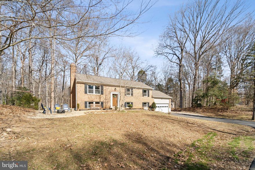 OFFER DEADLINE 03/09 @ 3PM --NEW, NEW, NEW and oh yeah, that's NEW too!  So much done in the last couple of years.  Foyer entry boasts beautiful craftsman style railing with iron balusters.   STUNNING kitchen remodel with 42" white shaker style cabinets and designer two-tone island.  Stone counter tops, patterned tile backsplash, SS appliances, and recessed lighting.  Upper level is open concept to the family room.  Dining area offers a huge bay window and door to newly redone deck with stairs.  Hardwood floors.  Spacious primary bedroom with accent wall.  Updated primary bath with new vanity/toilets and lighting.  Nice sized secondary bedrooms.   New ceiling fans and lighting throughout and shelving in closets. Updated hall bath.  Lower level offers a rec room with newly redone fireplace surround and new flue/damper.  Walk-out level to the new paver/stone patio that wraps around to a sitting/fire-pit area.  HUGE bedroom/in-law suite with updated bath.  Laundry with NEWer washer/dryer and utility sink.  Nice size storage area.  Stay cozy with the NEW HVAC with nest thermostat and NEWer HWH and water softener!  Not to mention NEW attic insulation.  Roof NEW in 2024 along with NEW trim and gutter guards.  NEW exterior lighting and wi-fi garage door.  Large driveway with additional parking space on the side, perfect for your boat or RV.  Private rear yard with shed, playground set, raised garden beds and mature trees.  Recently pumped septic with new lid installed.   Think I got it all, but just so much -- truly move in ready!  Well desired neighborhood in the heart of it all!   List of all upgrades and dates provided.