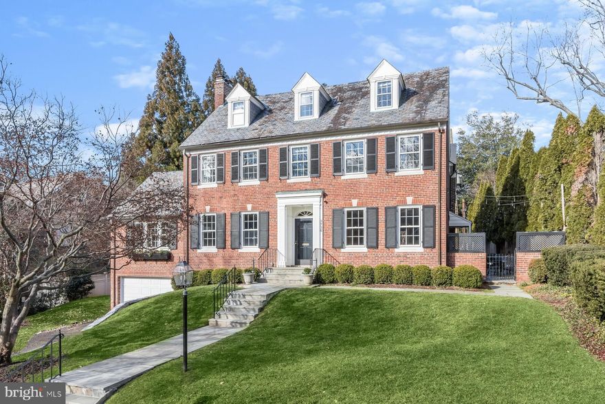 This stately, brick, Georgian-style home in prestigious Spring Valley offers elegance and comfort with its 6 bedrooms, 4.5 bathrooms, and a wealth of desirable features, including large windows, hardwood floors, and a spacious backyard. Perched on a gentle slope, this grand residence is perfectly situated to capture bright sunlight throughout the day, providing a sense of privacy and elegance. The spacious layout includes rooms ideal for both entertaining and everyday living. The main level features a formal entry, an elegant living room, and dining rooms with beautiful moldings and wainscoting. The inviting eat-in kitchen boasts stainless steel appliances, ample counter space, a large walk-in pantry, and views of the private yard. Upstairs, the bright and welcoming primary bedroom offers generous proportions, an en-suite bathroom, and an enviable walk-in closet. Five additional bedrooms, each providing privacy and comfort, complete this home. The finished lower level provides additional living and storage space. With a total of 4,895 square feet of finished living space, this home proudly occupies a quarter-acre lot, offering an impressive footprint. Just blocks away from Spring Valley’s shops, restaurants, and local parks, this location provides convenient access to major commuter routes, bus lines, biking trails, and Sibley Hospital.