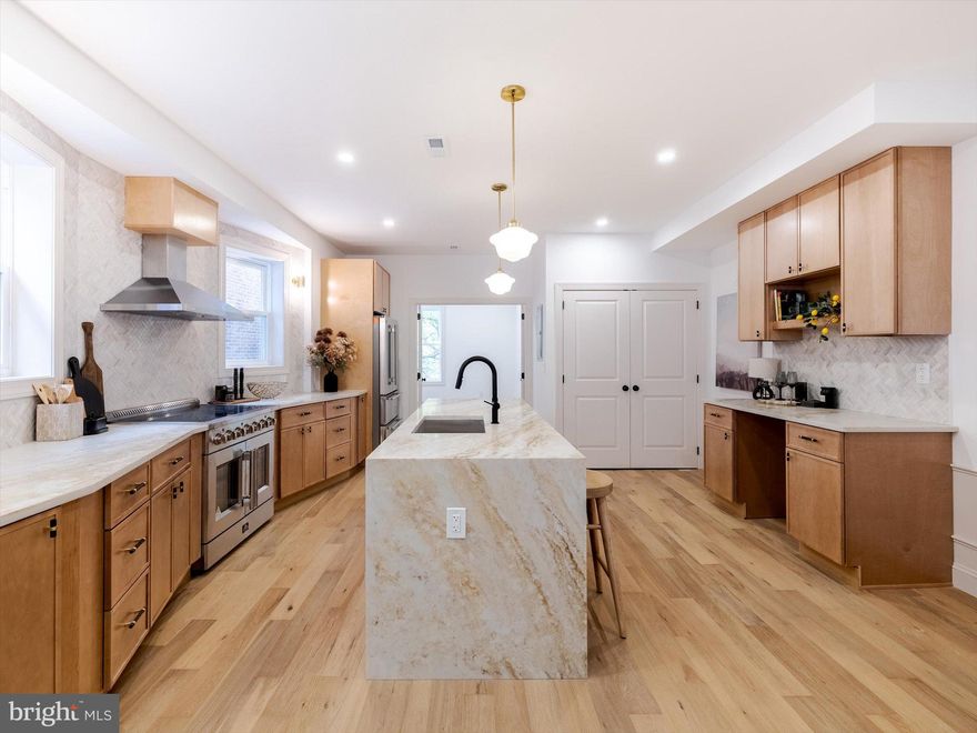 A METICULOUSLY RENOVATED DUPLEX in the best part of West Philadelphia right on the Malcolm X park.  413 S 51st Street is a legal duplex that has been thoughtfully redesigned, featuring all new mechanicals, brand new electrical systems, and high-end finishes that perfectly blend historic character with contemporary comfort. 

The rear portion of the first floor hosts a charming LARGE 1 BED 1 BATH APARTMENT, fully renovated with all new appliances, modern finishes, and its own laundry and home office area. With a separate electric meter, this unit offers privacy and independence—ideal for tenants or extended family. The potential rental income can significantly offset your mortgage, adding exceptional value to this remarkable property.
 
The larger apartment spans three impressive levels, offering 5 BEDROOMS and 3.5 BATH UNIT of refined living space. 

First Floor: 
Step through the inviting entry into a warm and sophisticated library/home office/guest bedroom, complete with a stylish half bath and framed by the home’s beautiful original staircase—a striking nod to its historic roots.

Second Floor:
An elegant living room overlooks the park, featuring a custom-built TV wall with shelving and a modern fireplace, creating a perfect gathering space. The breathtaking kitchen is a true showpiece—equipped with top-of-the-line appliances, a large waterfall island with deep sink, and an adjoining drink bar with wine fridge. A guest suite or study with an en suite bath, plus a laundry area and pantry space, complete this level with both beauty and practicality.

Third Floor:
The primary suite offers peaceful park views and a spa-inspired primary bathroom with double sinks, a soaking tub, and a separate glass shower. Two additional bedrooms and a full hall bathroom provide generous space for family or guests.

Every detail of this house has been carefully designed for comfort, functionality, and style. From the high-end craftsmanship inside to the refreshed exterior curb appeal, this home delivers modern luxury in one of Philadelphia’s most sought-after neighborhoods—just moments from Clark Park, UPenn, and the city’s best dining and cafes.