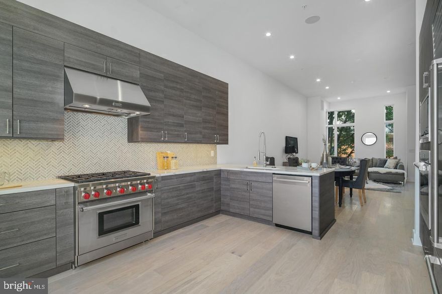 Live in opulence in the fully loaded home at Lippincott Alley. Lippincott is a premier living destination in the heart of Old City. Located next to the historic Arch Street Meeting House, the townhomes at Lippincott provide a sanctuary from the bustling pace of life in the city. Enter your front door from a quiet, brick-paved lane and step into a home that is refreshingly contemporary or enter from your 2-car GARAGE! Enjoy an open concept main level floor plan that is perfect for entertaining. Relax and unwind in the comfort of the living room. This light-filled space highlights the natural beauty of the surrounding landscape. Cooking won't feel like a chore in this gorgeous kitchen equipped with Wolf and Sub-Zero appliances, granite countertops, plenty of cabinets for storage and direct access to your private balcony. The second floor features two large bedrooms with custom walk-in closets. Each bedroom has its own bath - one with a tub/shower combo, the other with a glass-enclosed shower. A bonus feature of the space includes upper-level laundry with Whirlpool front loading washer and dryer. Pamper yourself in the master suite. Enjoy a generous walk-in closet with custom storage system and spa-like master bath featuring a double vanity, free-standing soaking tub, large glass-enclosed shower with multiple shower heads and rain shower plus tons of natural light. A private elevator whisks you up to the roof deck where you can enjoy the view and watch the fireworks at Penn's Landing. The pilot house is equipped with a wet bar, beverage center, open shelving and lounge area - plus a powder bath. Leave the car parked in your private two car garage. Enjoy the ease of being walking distance to the best of Old City - located just minutes from public transit, the city's best restaurants, boutique shops, art galleries and area attractions. Additional features of this 3-4 bedroom, 4 full and 2 powder bath home include include a finished basement, a full bath, flex space for a 4th bedroom and extra storage, gorgeous hardwood floors and tile throughout, high ceilings, and alarm system. Luxury living in one of the most historic locations in the US. What more could you ask for? Schedule a showing today. All square footage numbers are approximate and include above and below grade measurements. Tax abatement started in  2019.